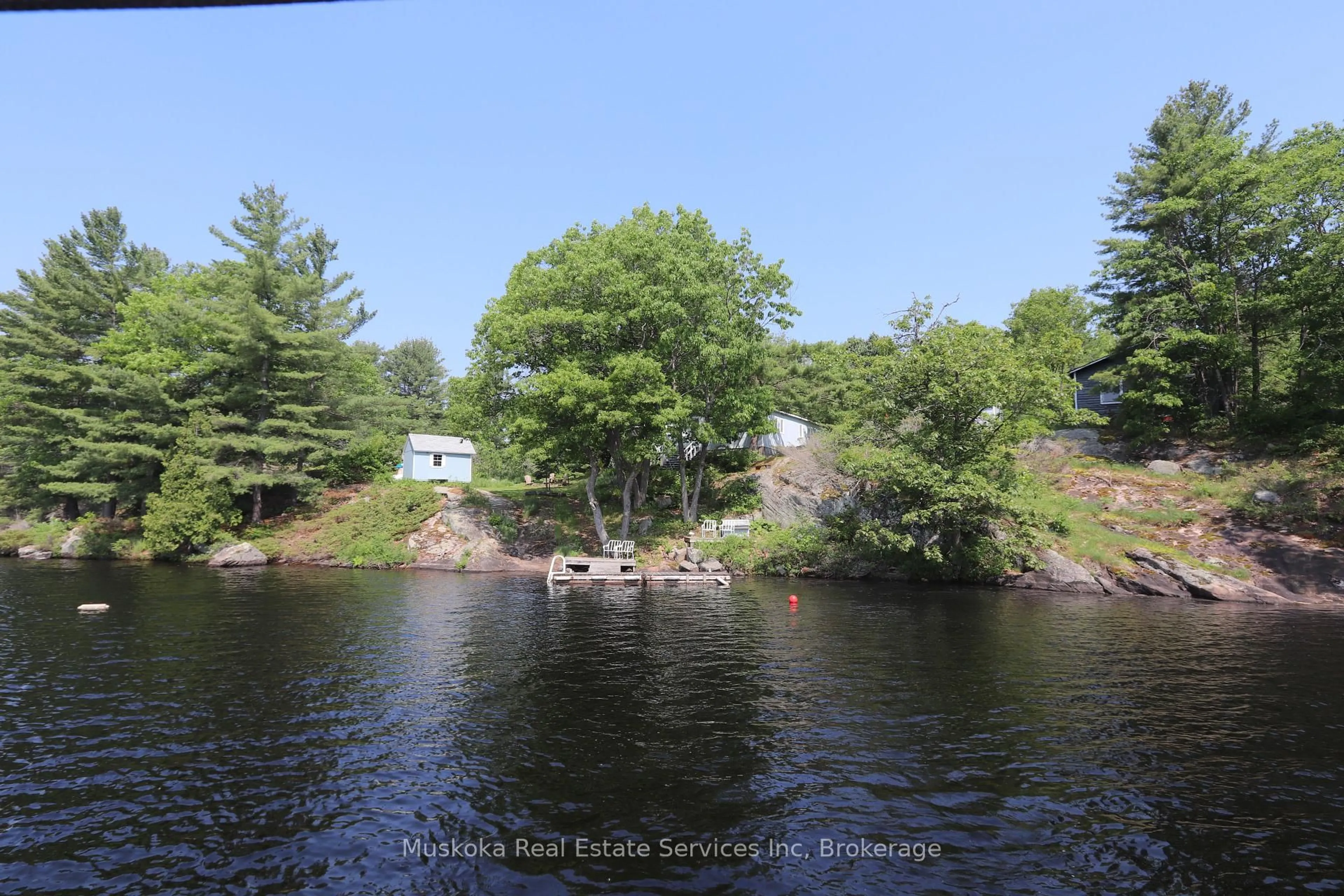A pic from outside/outdoor area/front of a property/back of a property/a pic from drone, water/lake/river/ocean view for 1113 Sam Cook Rd, Gravenhurst Ontario P1P 1R3