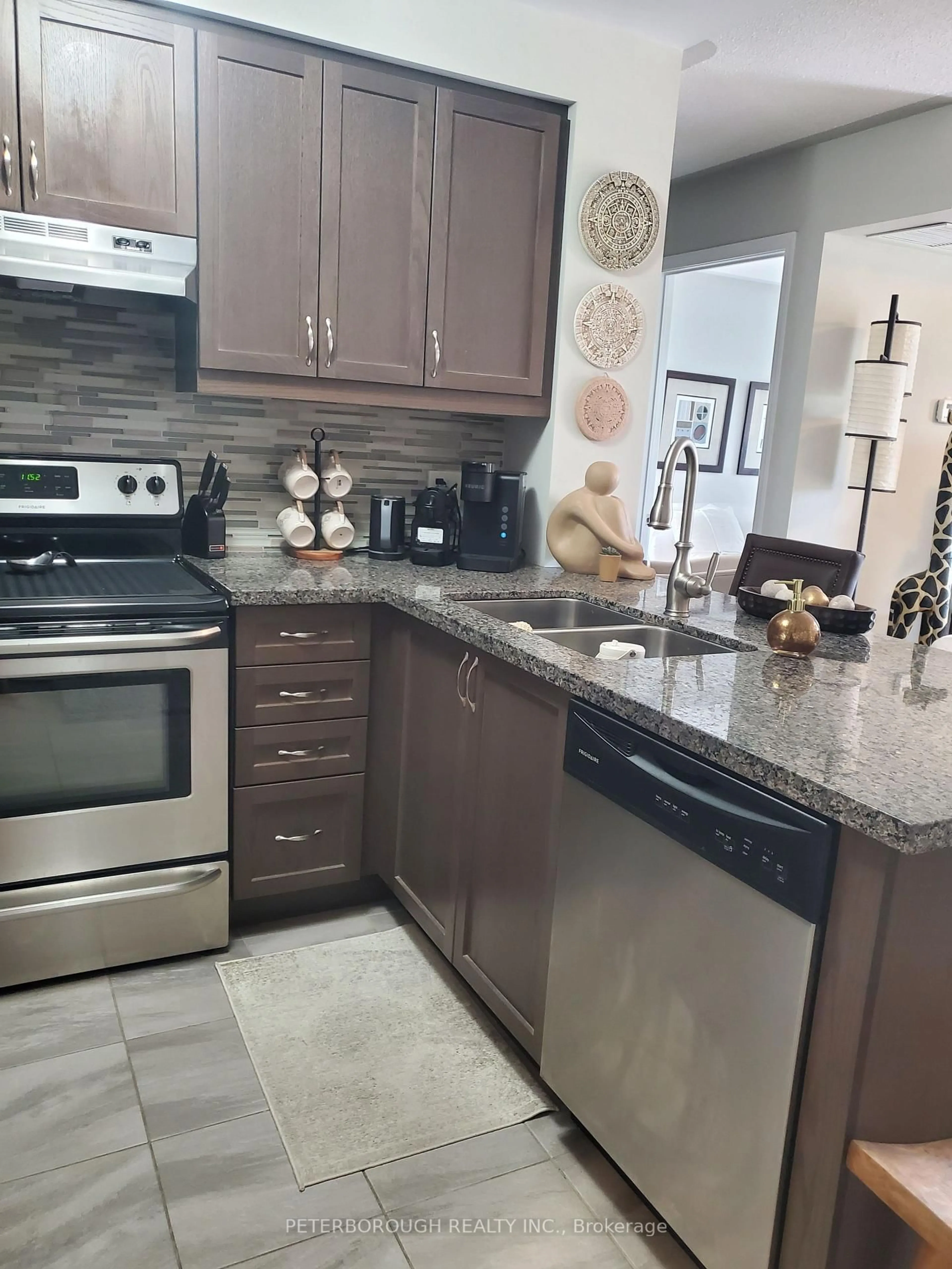Open concept kitchen, ceramic/tile floor for 910 Wentworth St #301, Peterborough West Ontario K9J 8R8