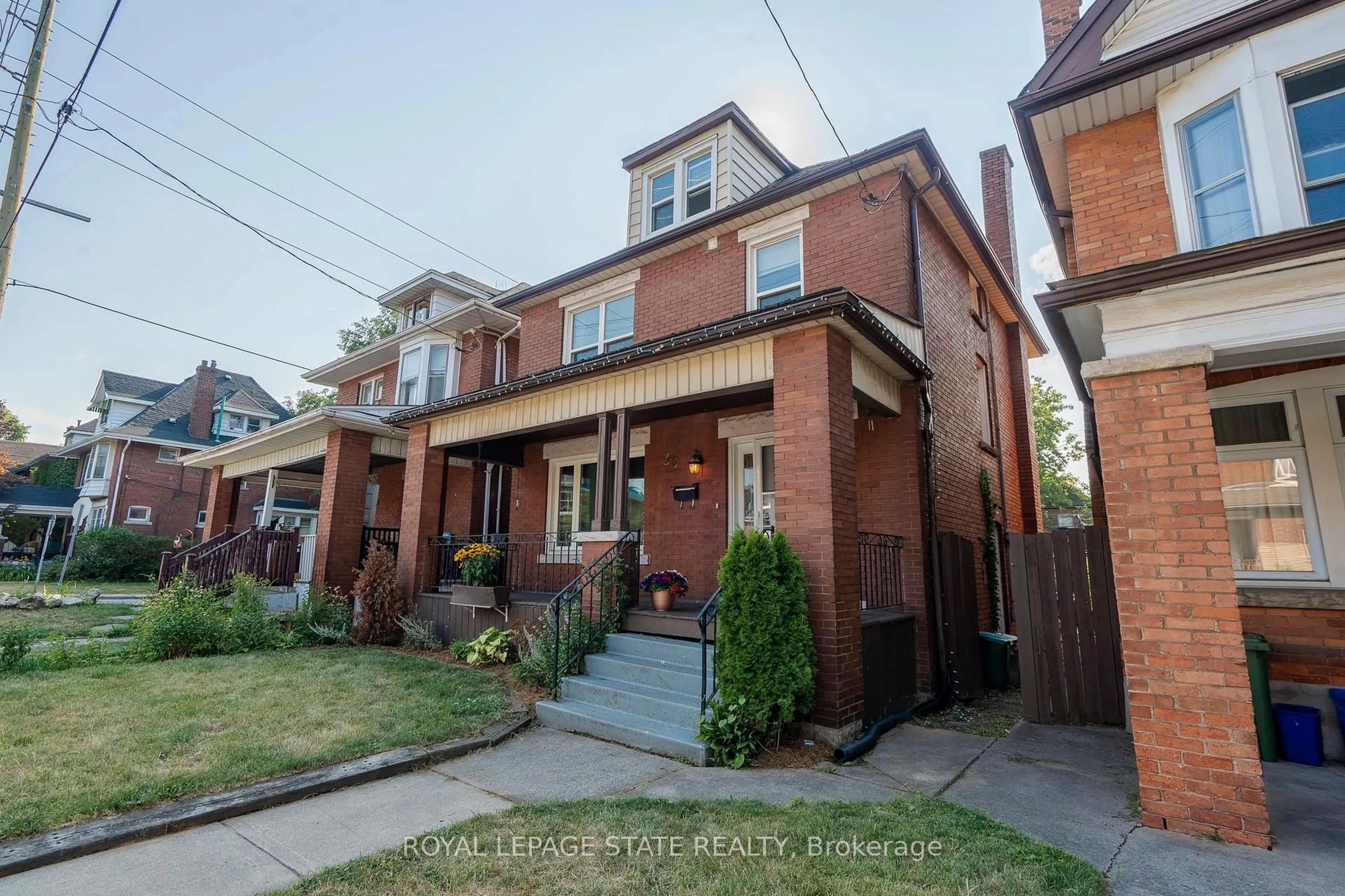 Home with brick exterior material, street for 36 Spadina Ave, Hamilton Ontario L8M 2W9