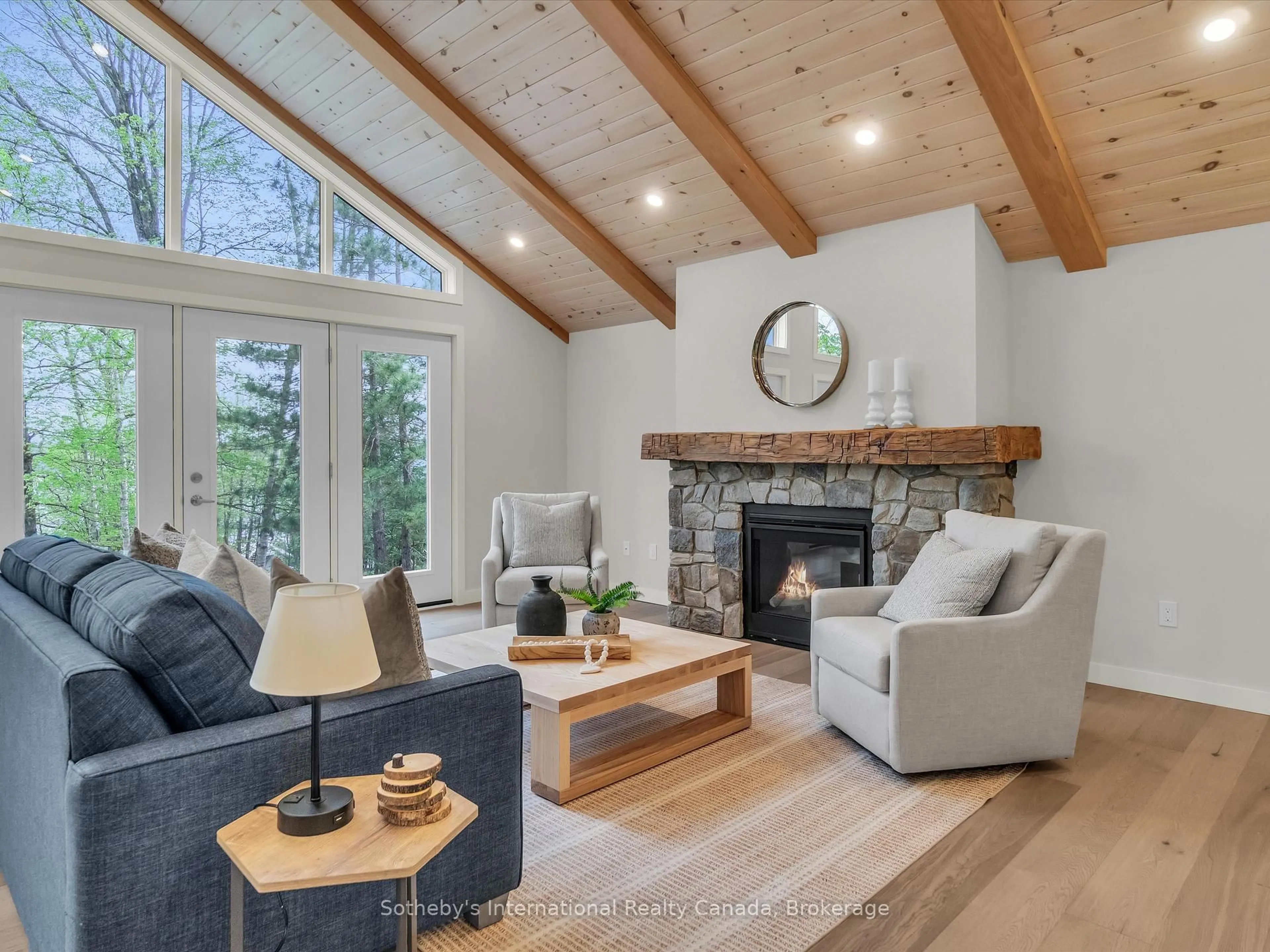 Living room with furniture, wood/laminate floor for 3179 Muskoka Rd 117 Rd #2, Lake of Bays Ontario P0B 1A0