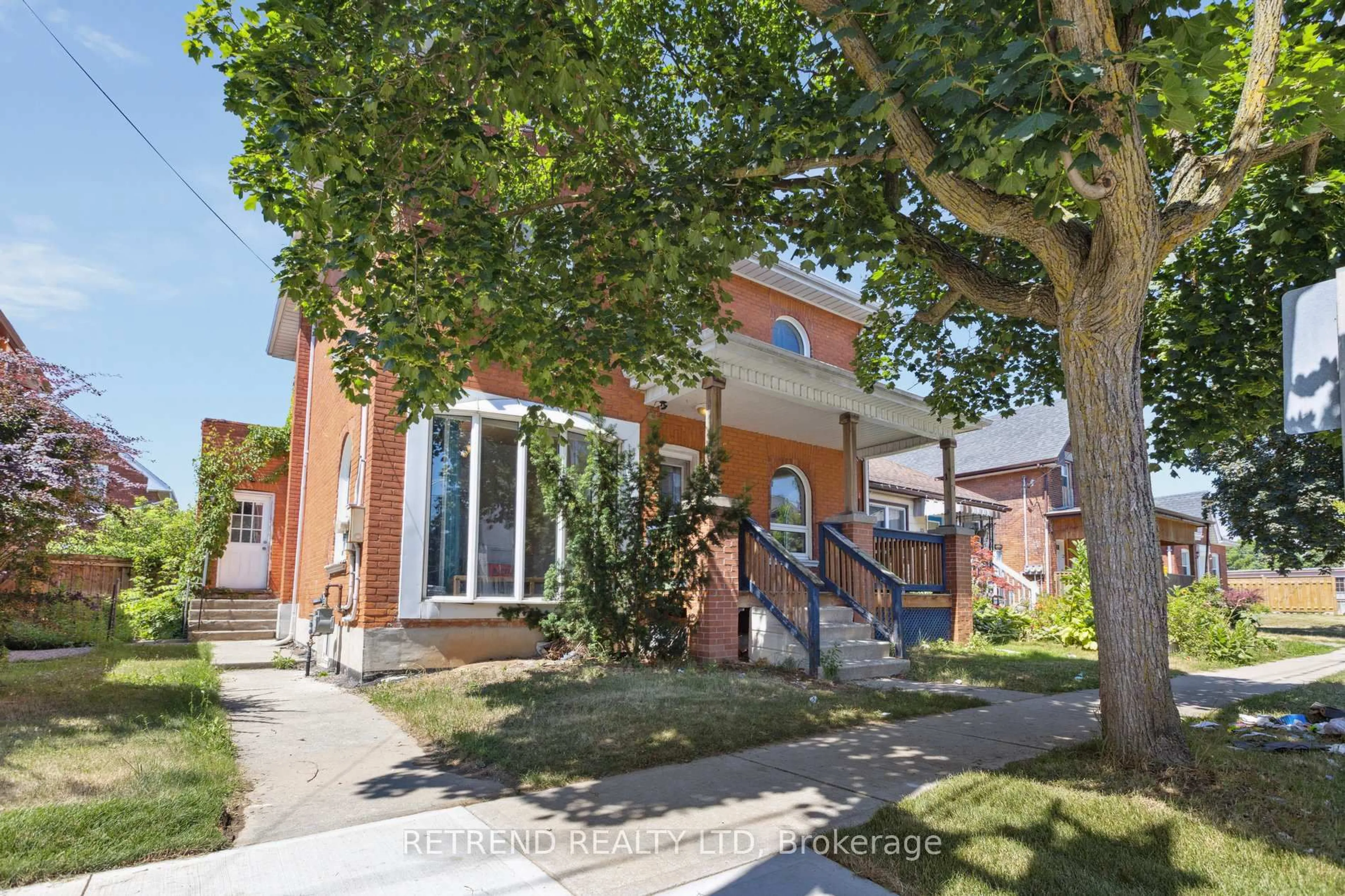 Home with brick exterior material, street for 219 Erie Ave, Brantford Ontario N3S 2H1