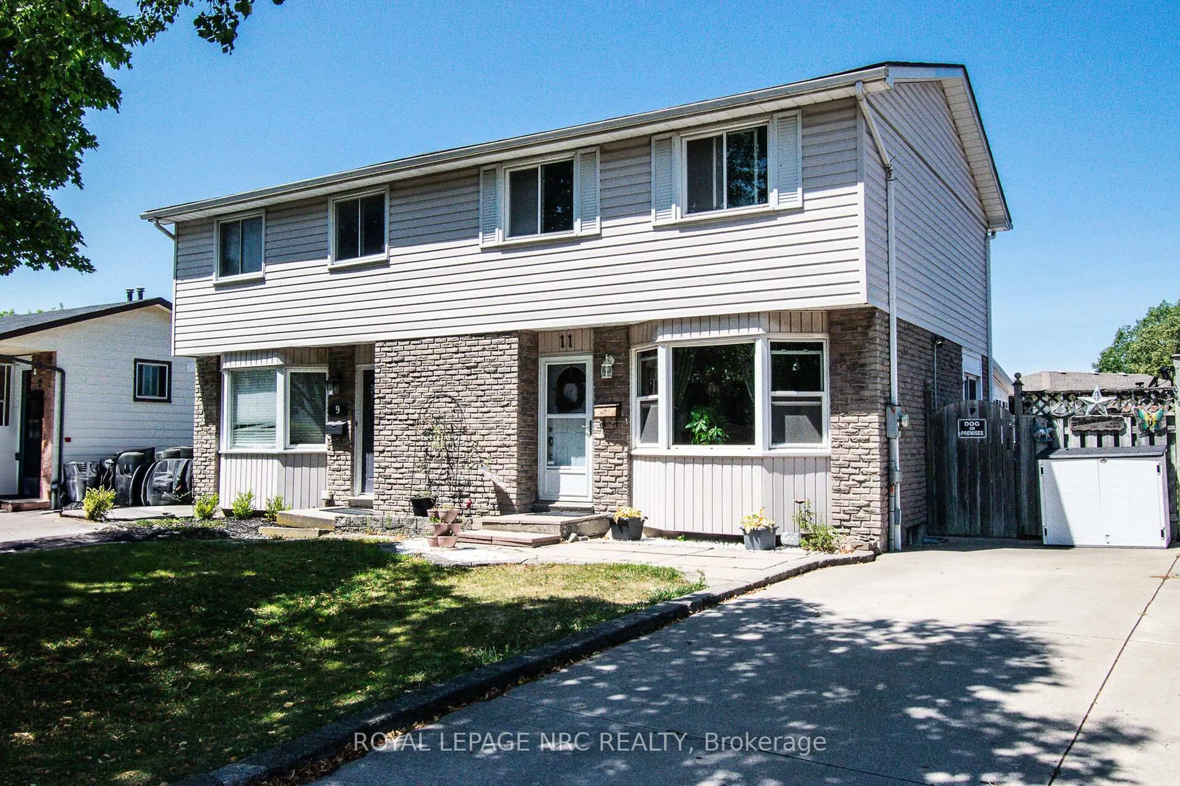 Home with vinyl exterior material, street for 11 Exeter Dr, St. Catharines Ontario L2P 3M9