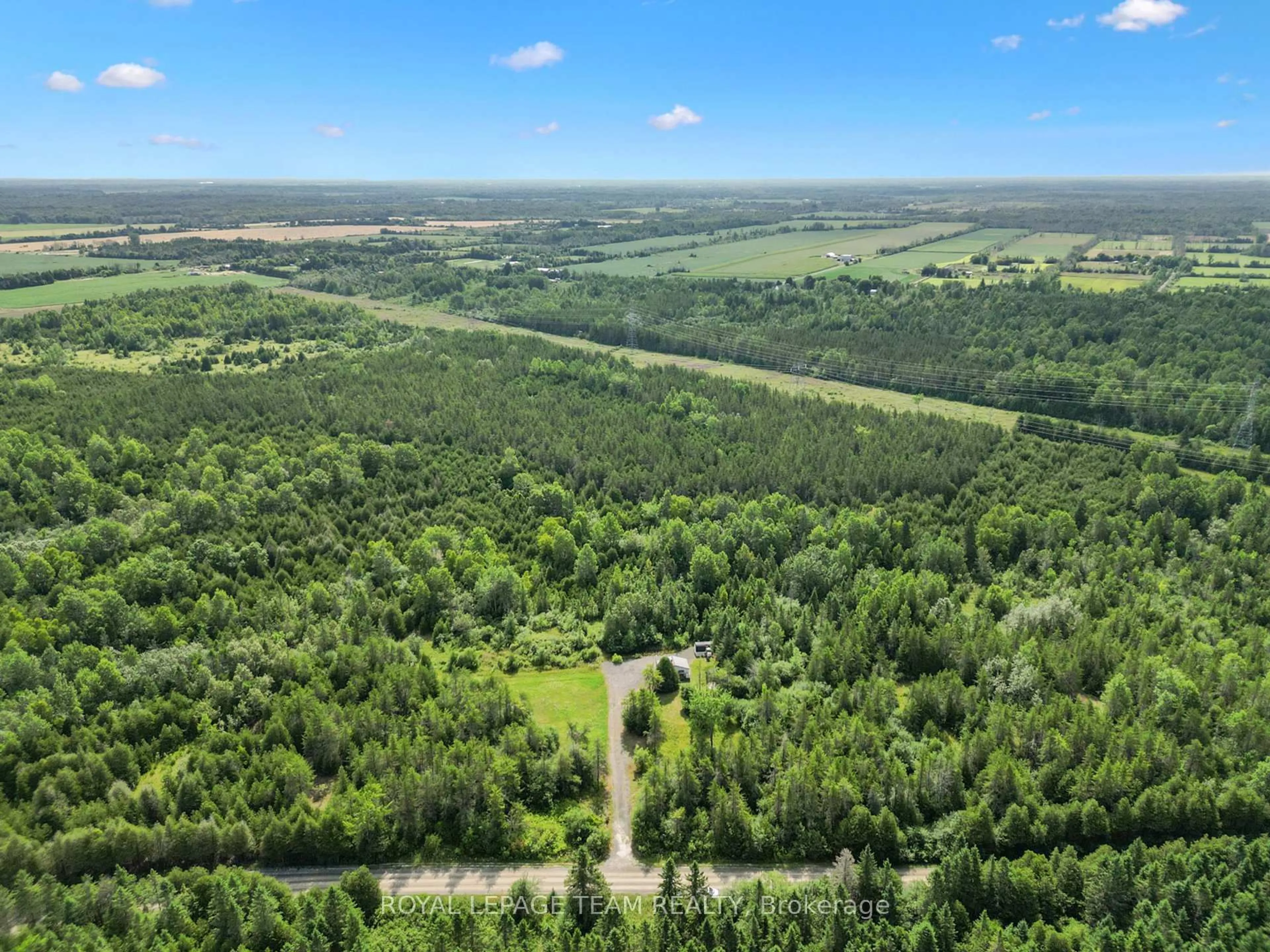 A pic from outside/outdoor area/front of a property/back of a property/a pic from drone, forest/trees view for 1349 Bolton Rd, Merrickville-Wolford Ontario K0G 1R0