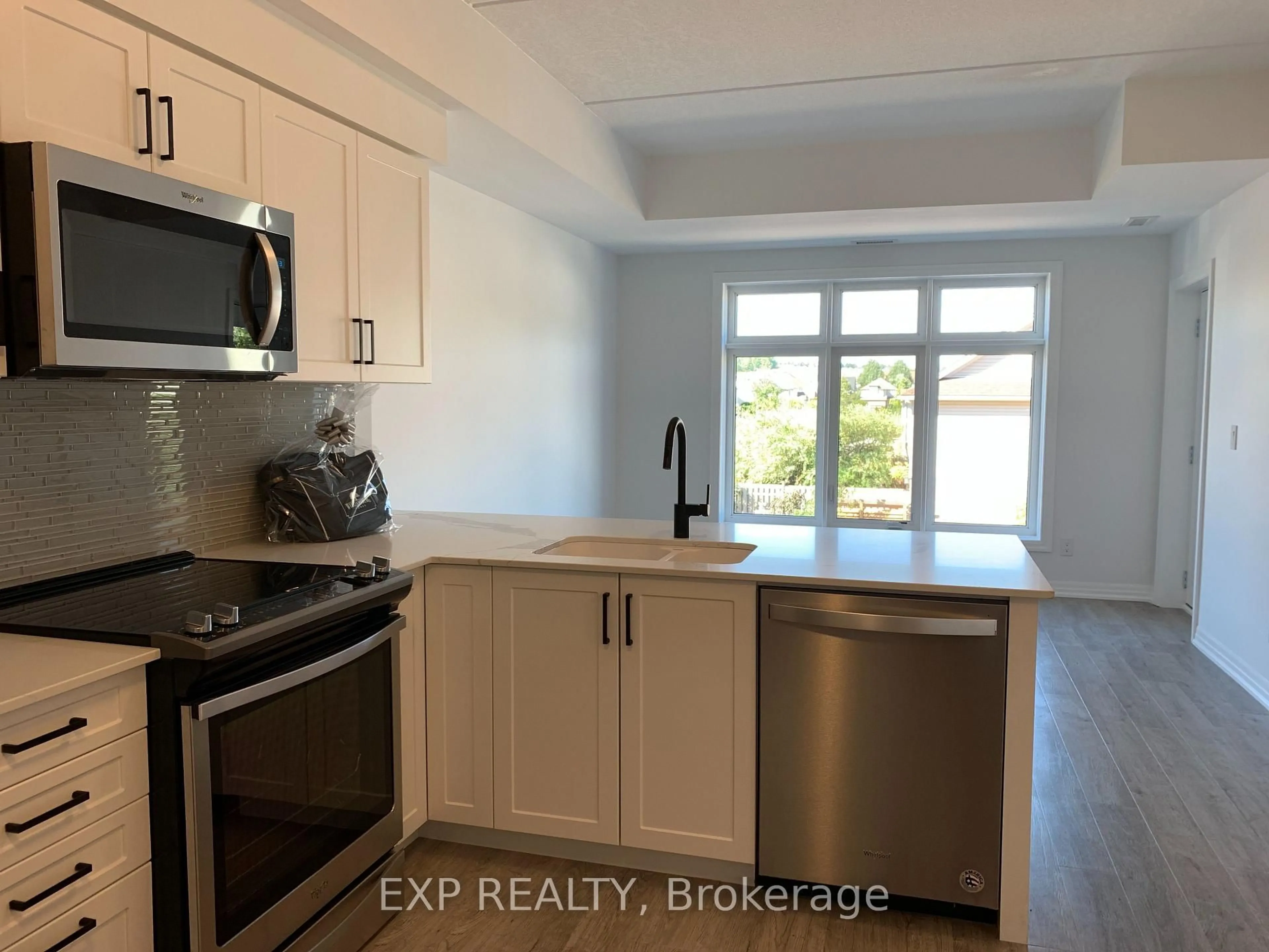 Standard kitchen, ceramic/tile floor for 195 commonwealth St #209, Kitchener Ontario N2E 0H5