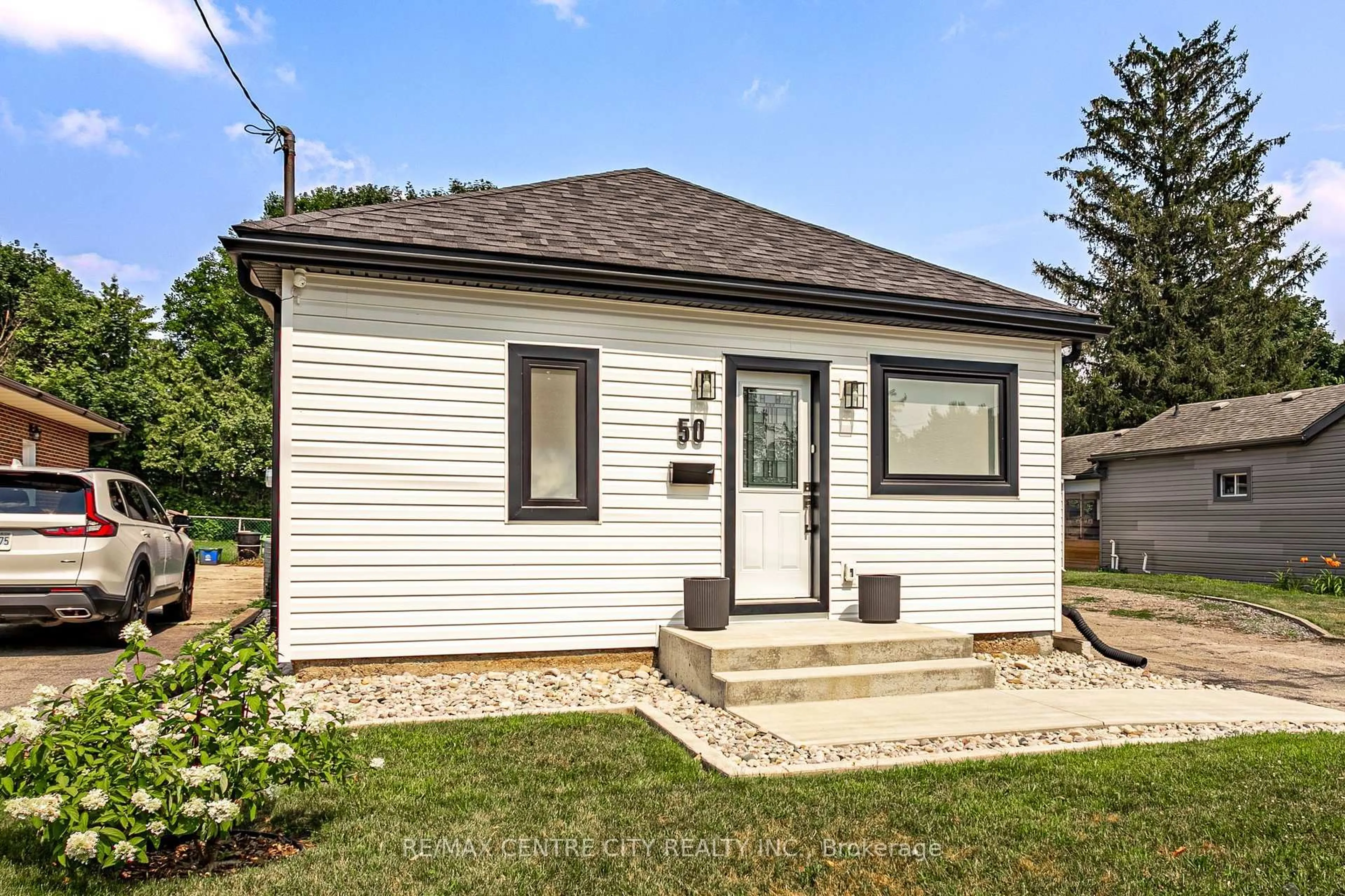 Home with vinyl exterior material, street for 50 McNay St, London East Ontario N5Y 1K7