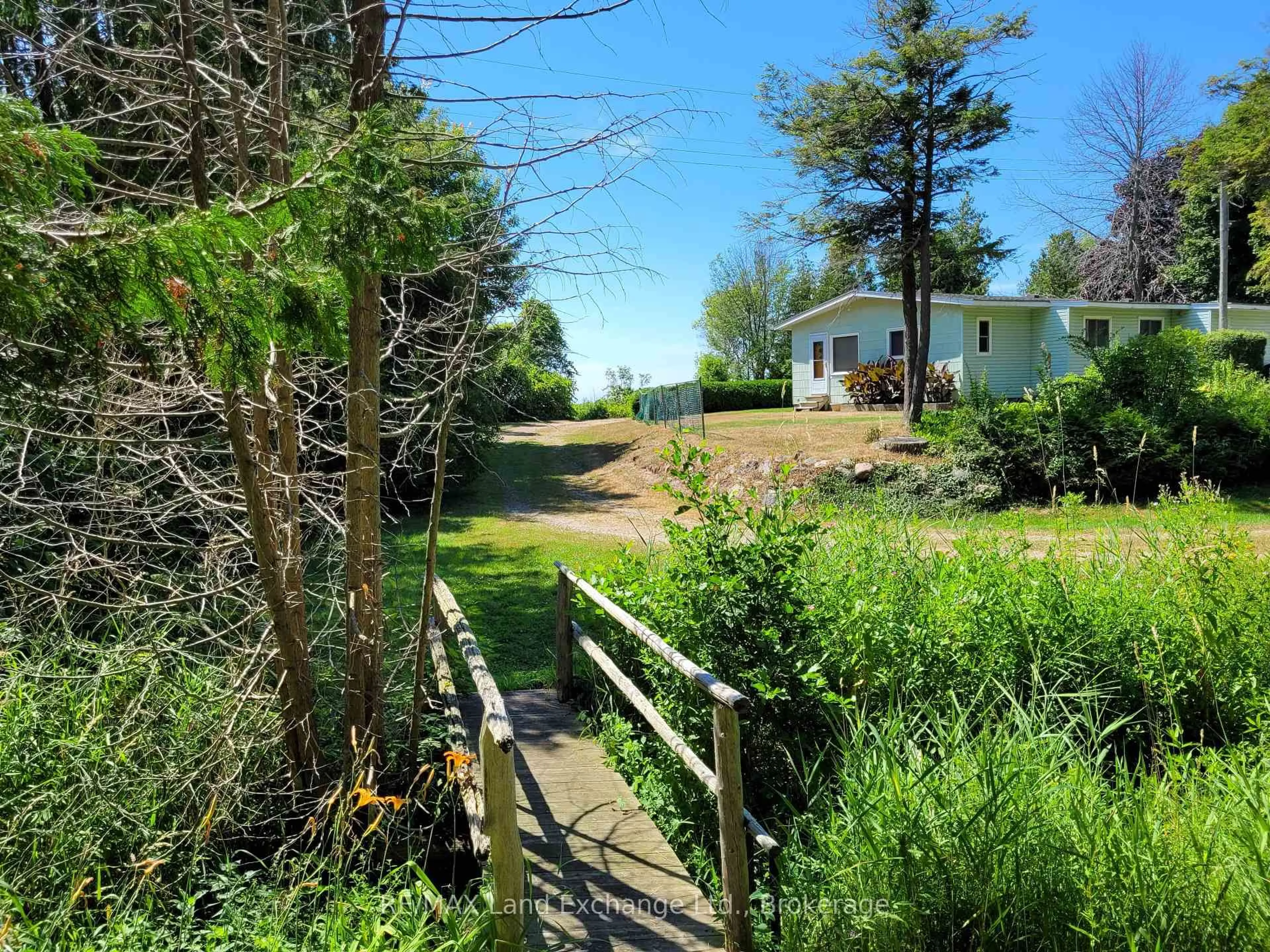 A pic from outside/outdoor area/front of a property/back of a property/a pic from drone, unknown for 213 Huron Rd, R. R. #1 Rd, Huron-Kinloss Ontario N2Z 2X3