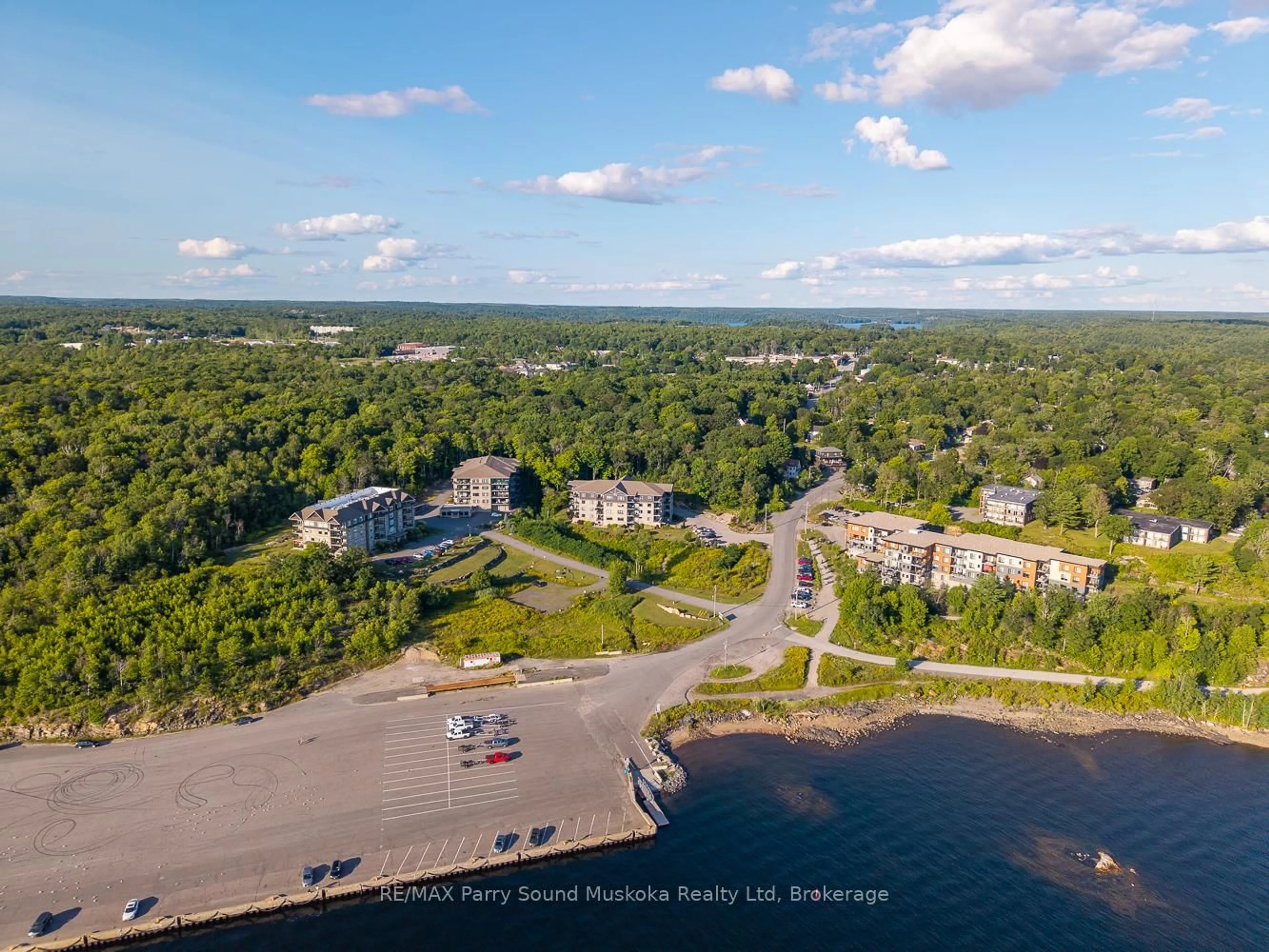 A pic from outside/outdoor area/front of a property/back of a property/a pic from drone, water/lake/river/ocean view for 11C Salt Dock Rd #107, Parry Sound Ontario P2A 3B6
