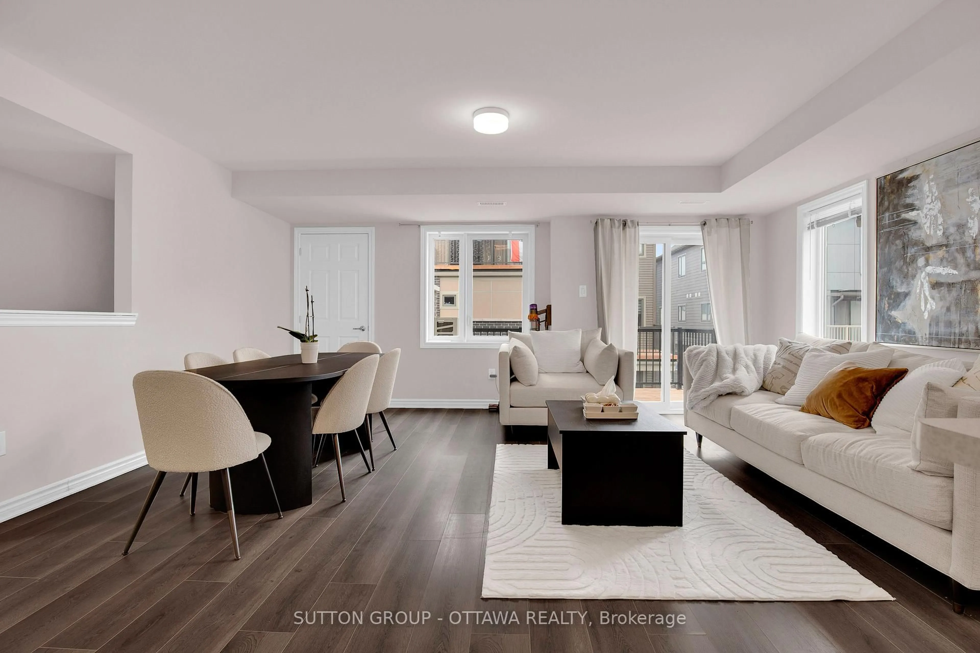 Living room with furniture, wood/laminate floor for 127 Anthracite Private, Ottawa Ontario K2J 7C8