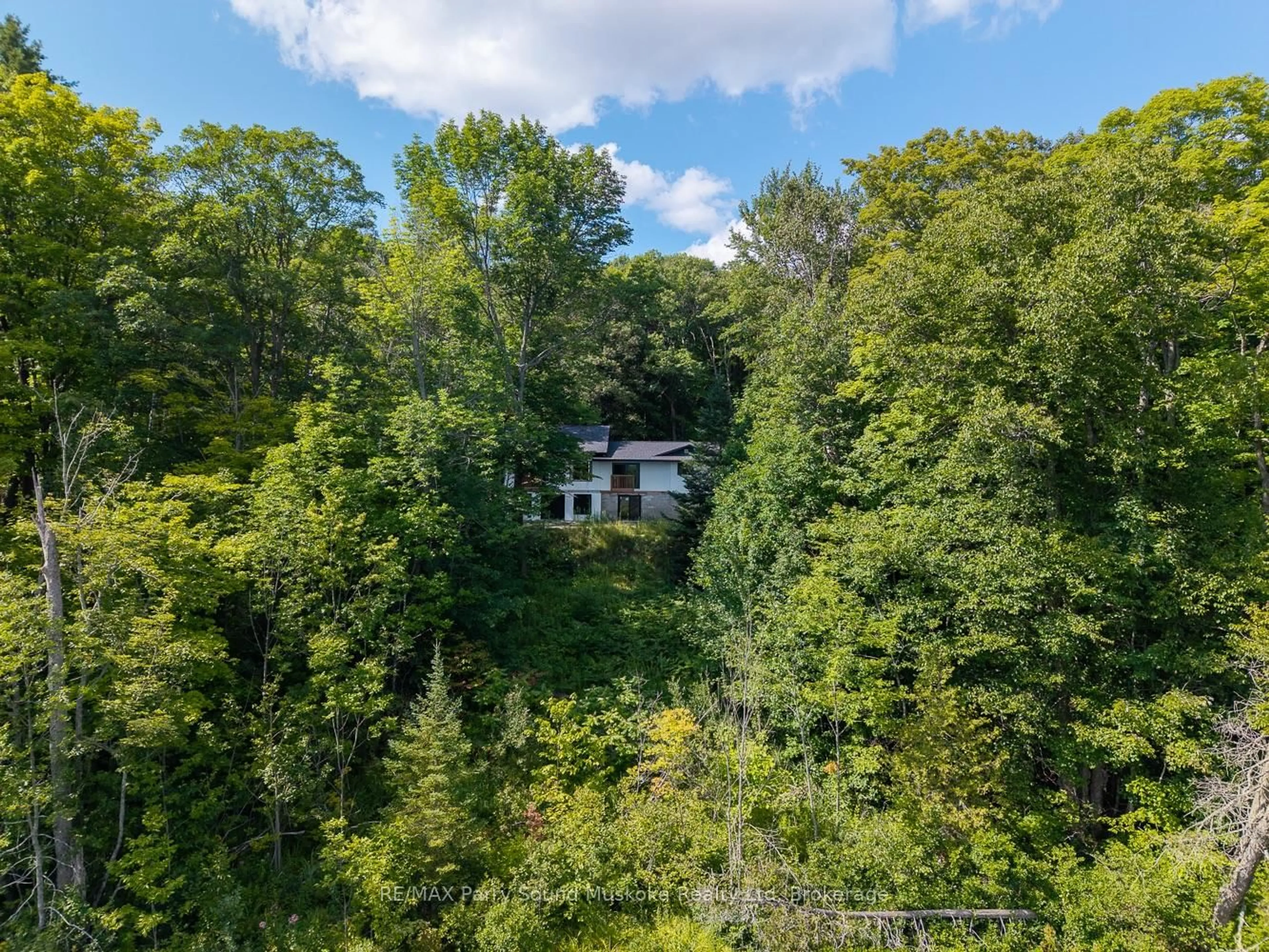 A pic from outside/outdoor area/front of a property/back of a property/a pic from drone, forest/trees view for 13 Rocky Rd, Seguin Ontario P2A 0B2