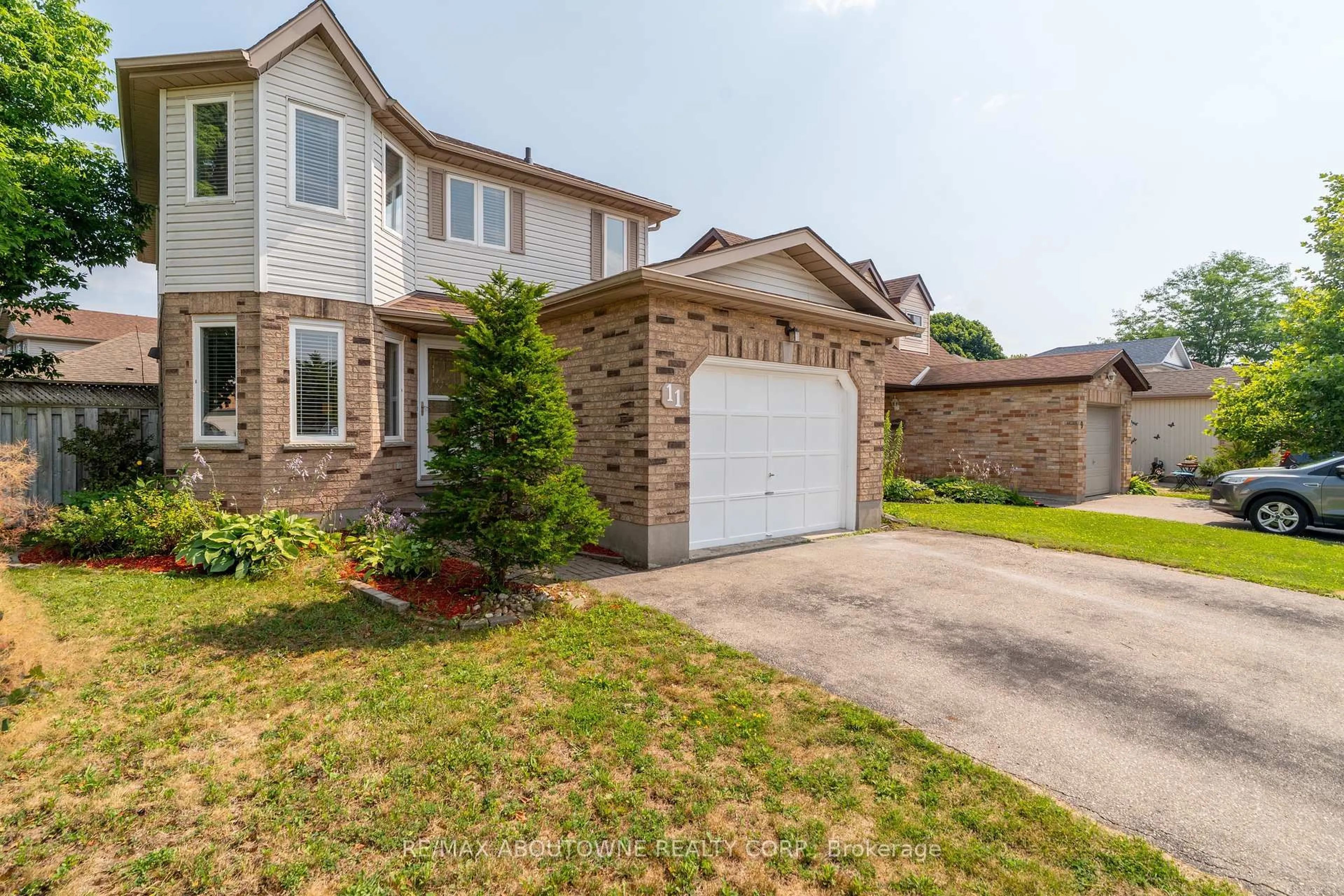Home with brick exterior material, street for 11 Bushmills Cres, Guelph Ontario N1K 1T5