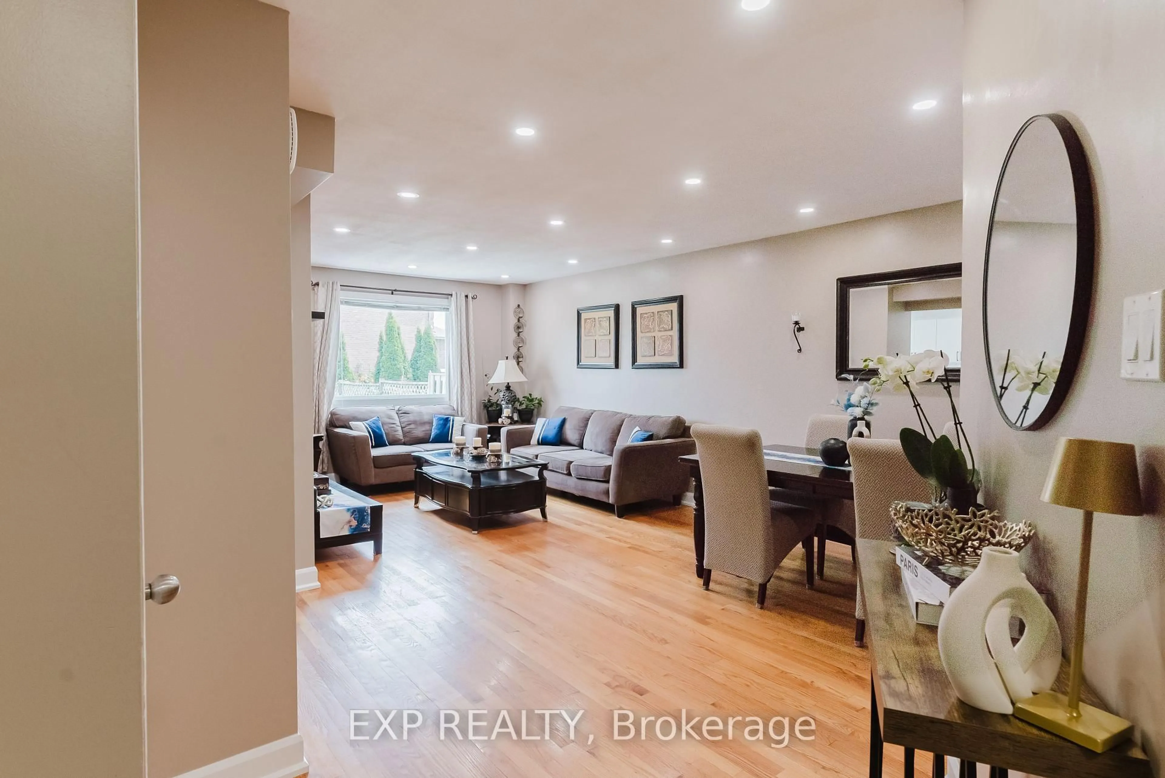 Living room with furniture, wood/laminate floor for 138 Acklam Terr, Ottawa Ontario K2K 2J5