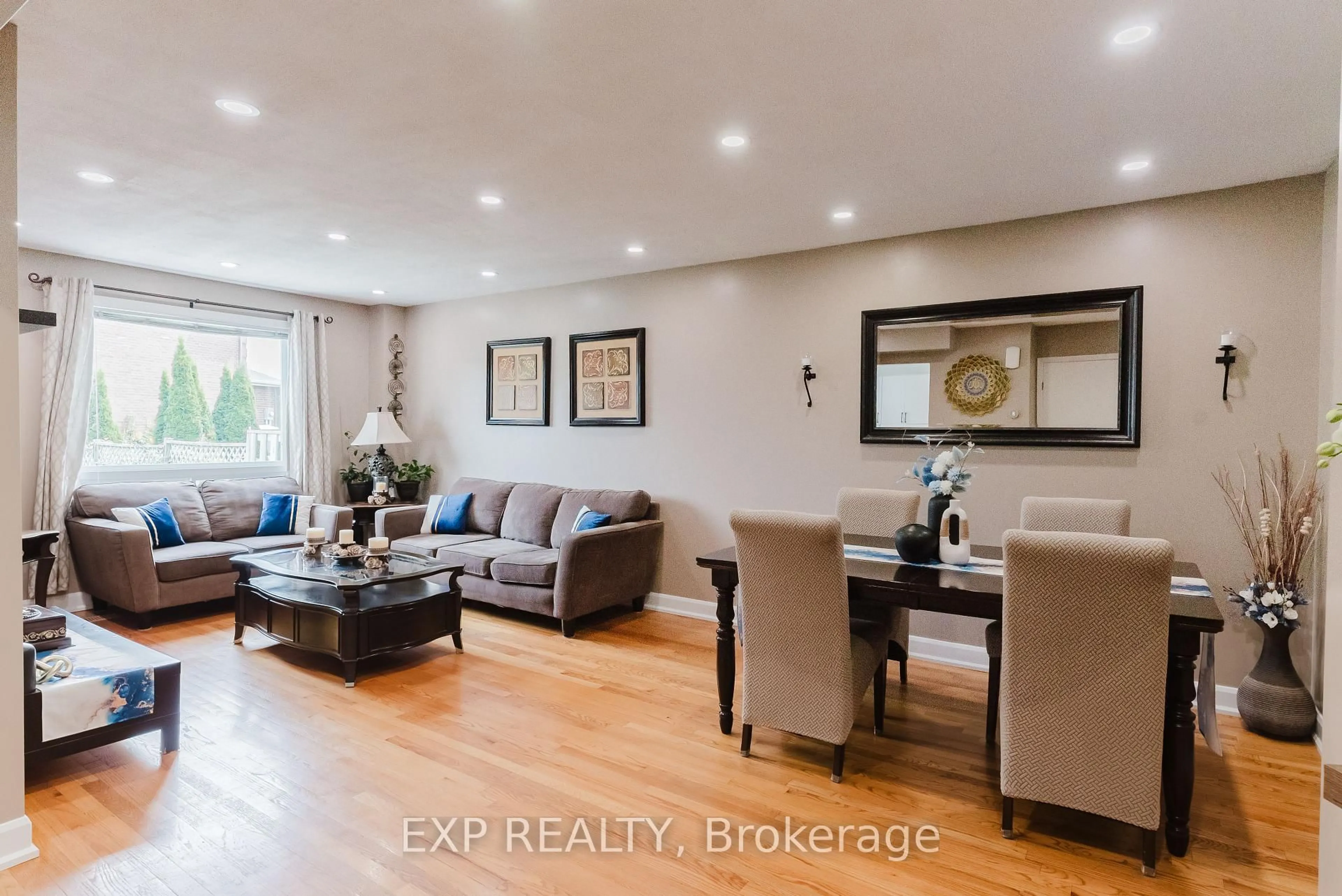 Living room with furniture, wood/laminate floor for 138 Acklam Terr, Ottawa Ontario K2K 2J5