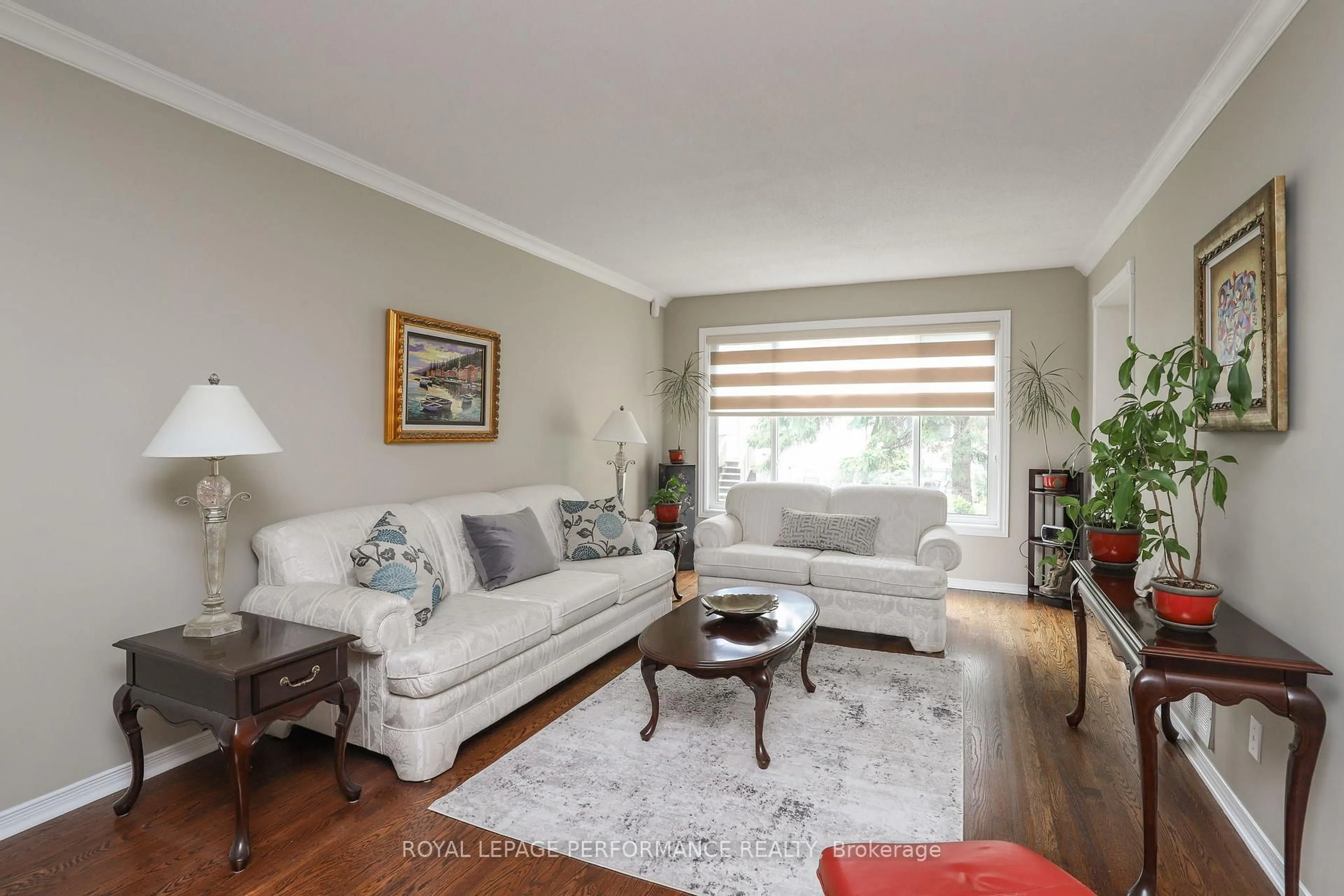 Living room with furniture, wood/laminate floor for 104 Stonebriar Dr #10, Ottawa Ontario K2G 5Y1
