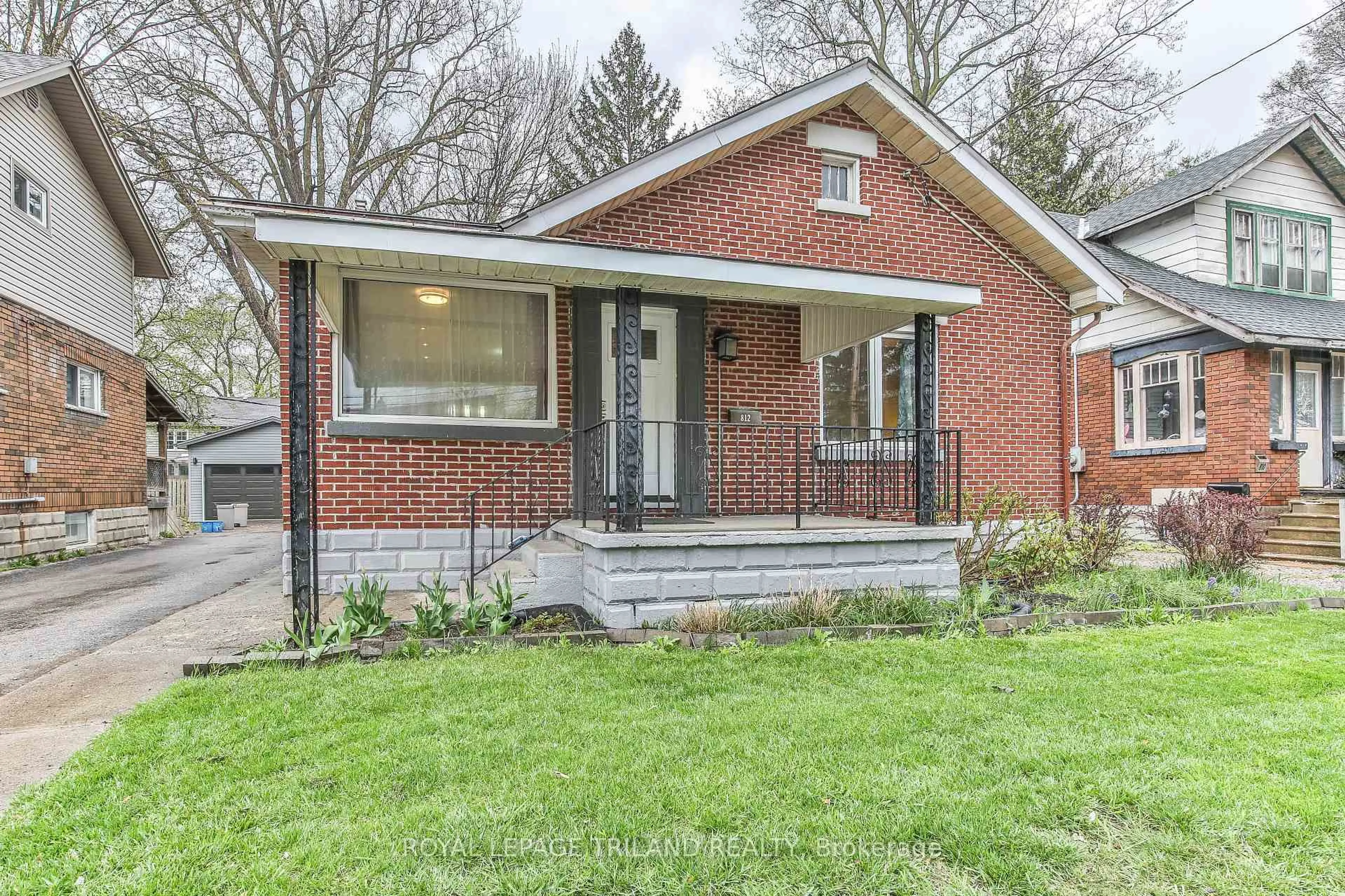 Home with brick exterior material, street for 812 ADELAIDE St, London East Ontario N5Y 2L9