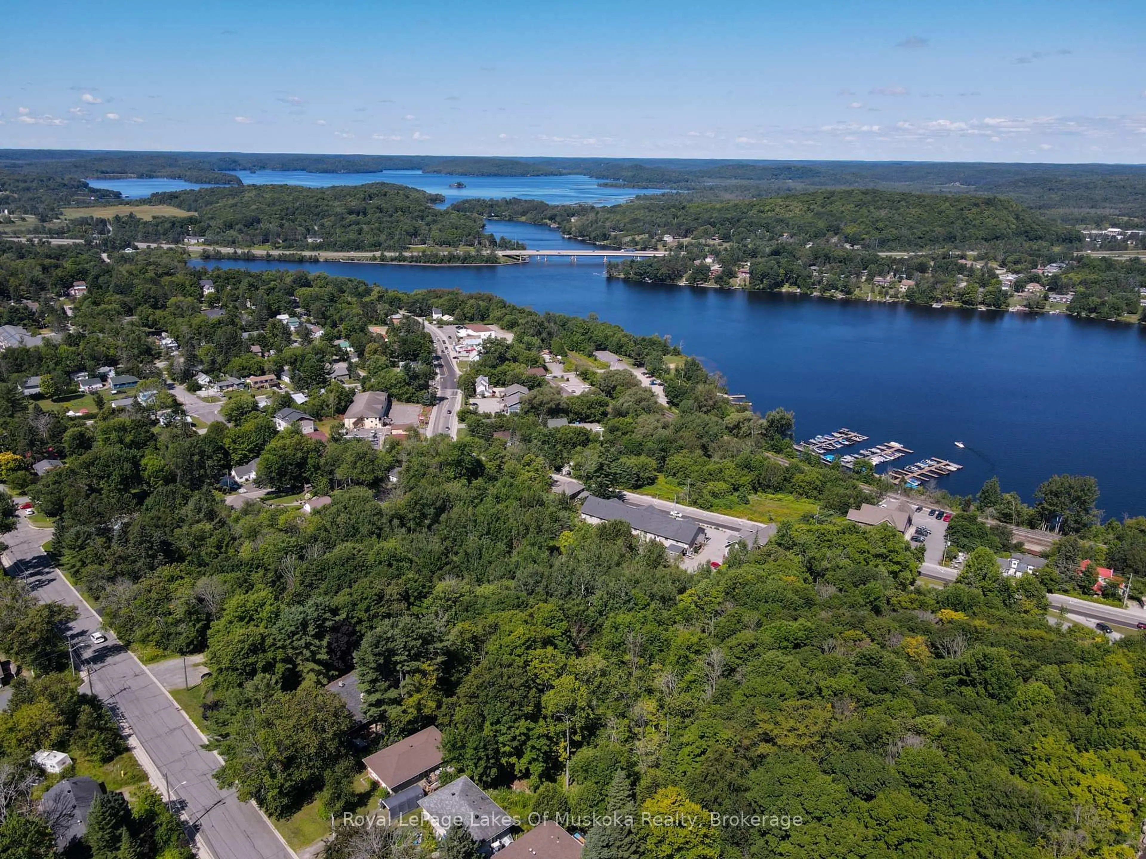 A pic from outside/outdoor area/front of a property/back of a property/a pic from drone, water/lake/river/ocean view for 63 Florence St, Huntsville Ontario P1H 1V4