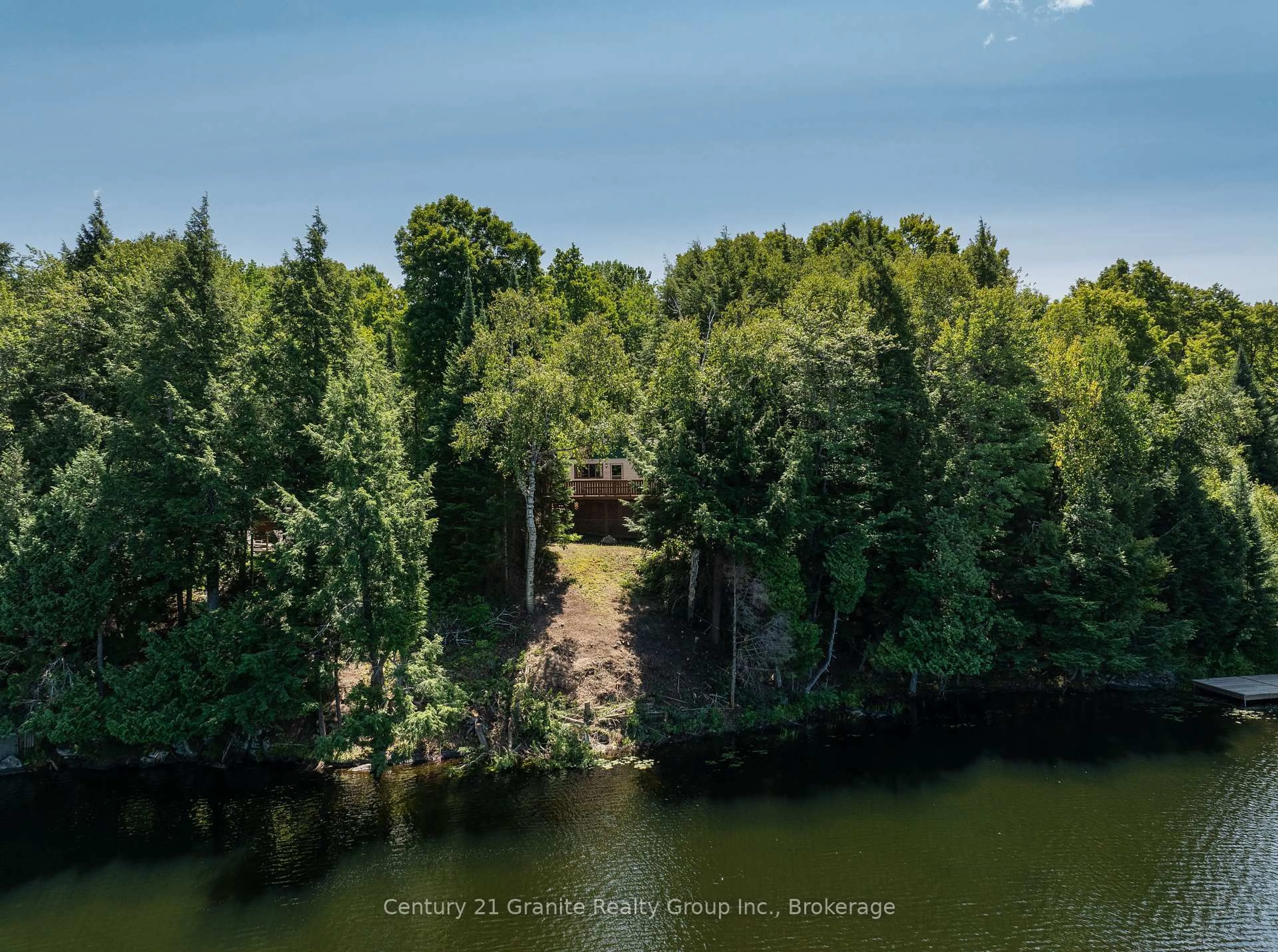 A pic from outside/outdoor area/front of a property/back of a property/a pic from drone, water/lake/river/ocean view for 1455 English Circ, Highlands East Ontario K0M 1R0