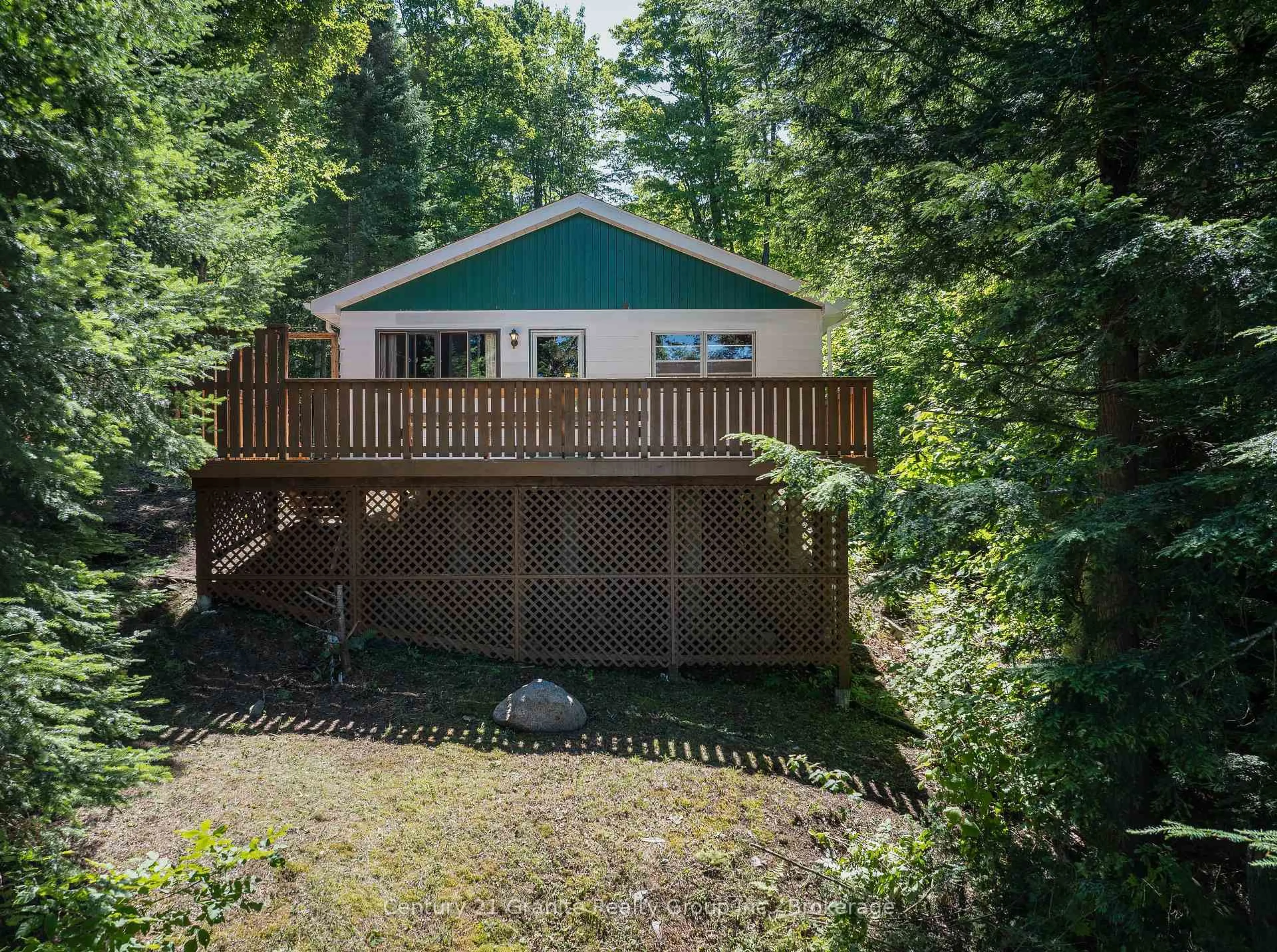 A pic from outside/outdoor area/front of a property/back of a property/a pic from drone, forest/trees view for 1455 English Circ, Highlands East Ontario K0M 1R0