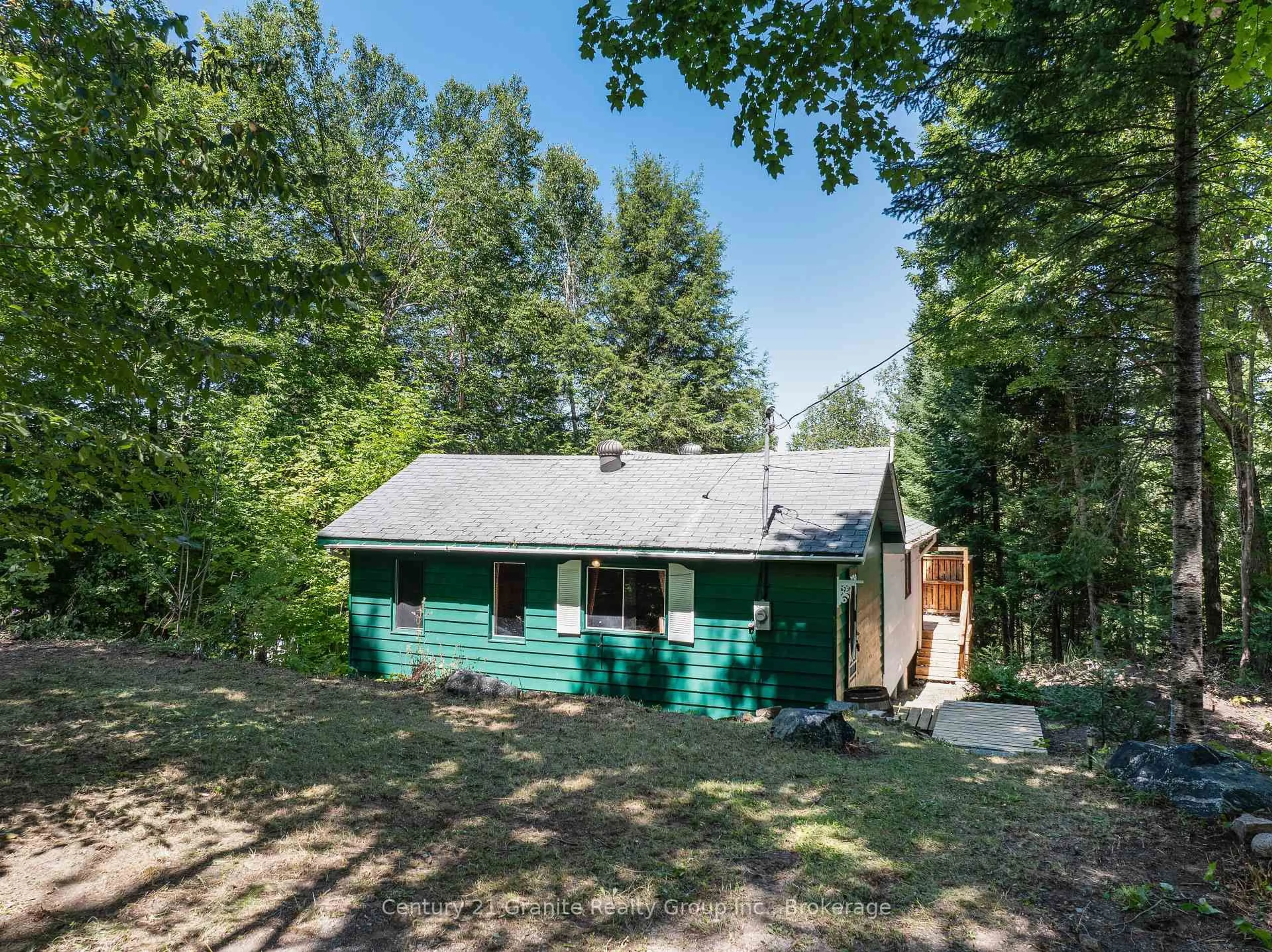 A pic from outside/outdoor area/front of a property/back of a property/a pic from drone, forest/trees view for 1455 English Circ, Highlands East Ontario K0M 1R0