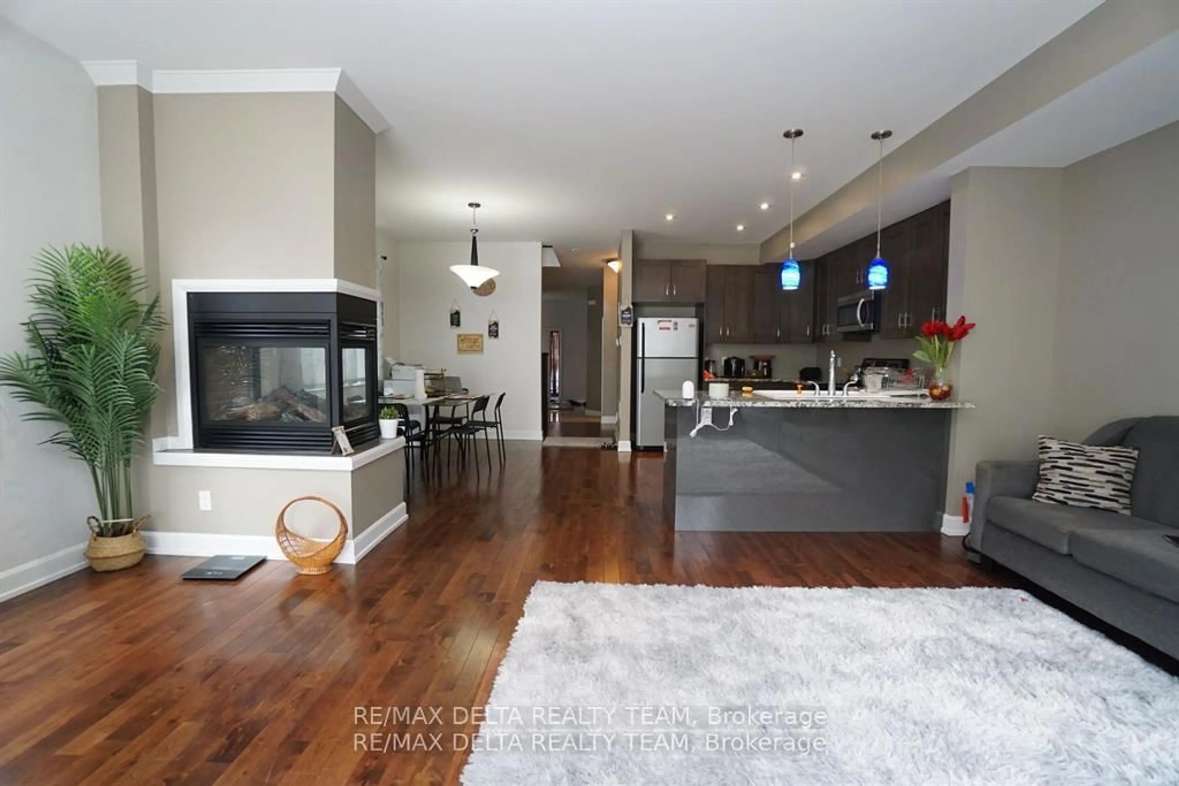 Open concept kitchen, wood/laminate floor for 498 Moodie Dr, Ottawa Ontario K2H 8A7