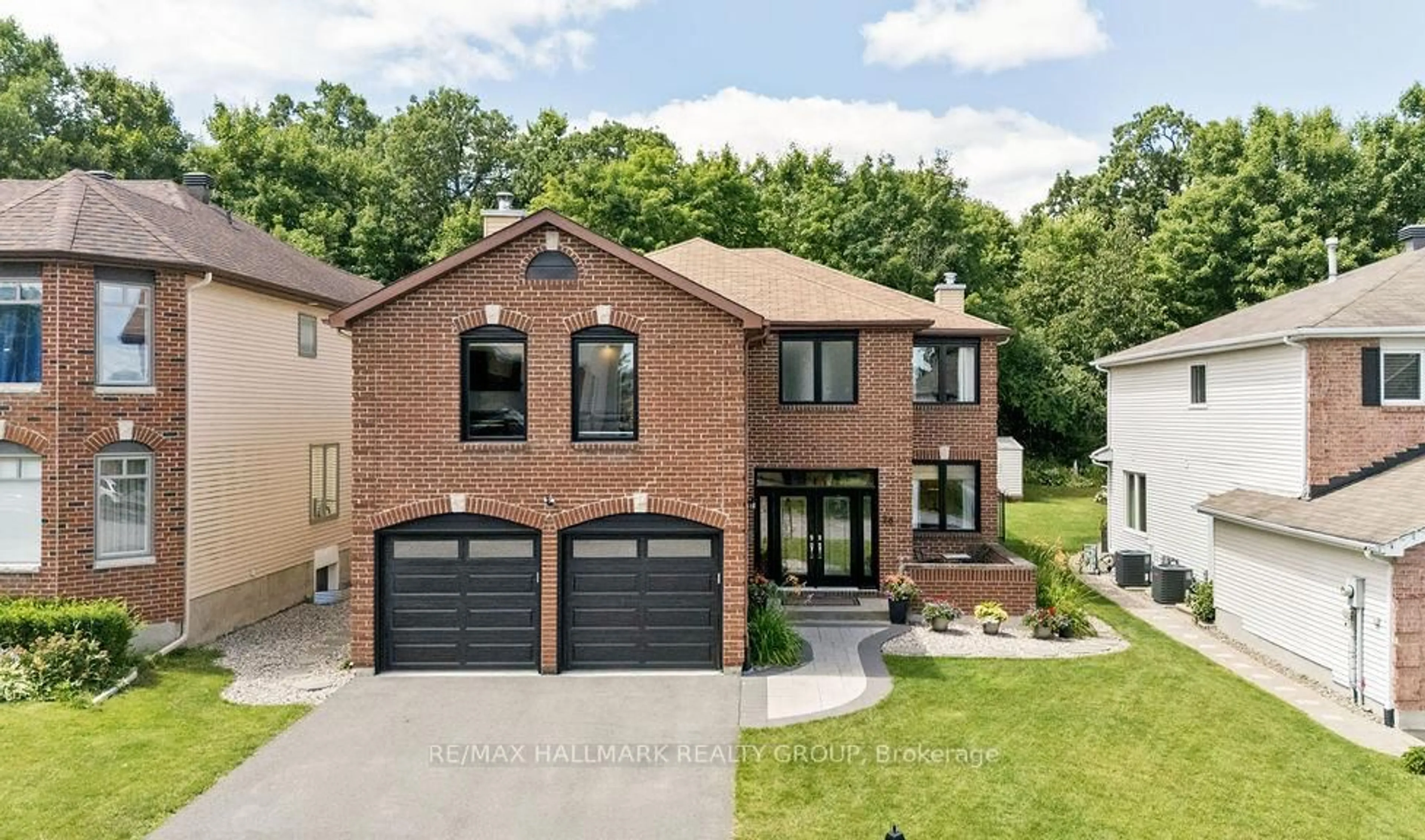 Home with brick exterior material, street for 26 Collingwood Cres, Ottawa Ontario K2K 2G7