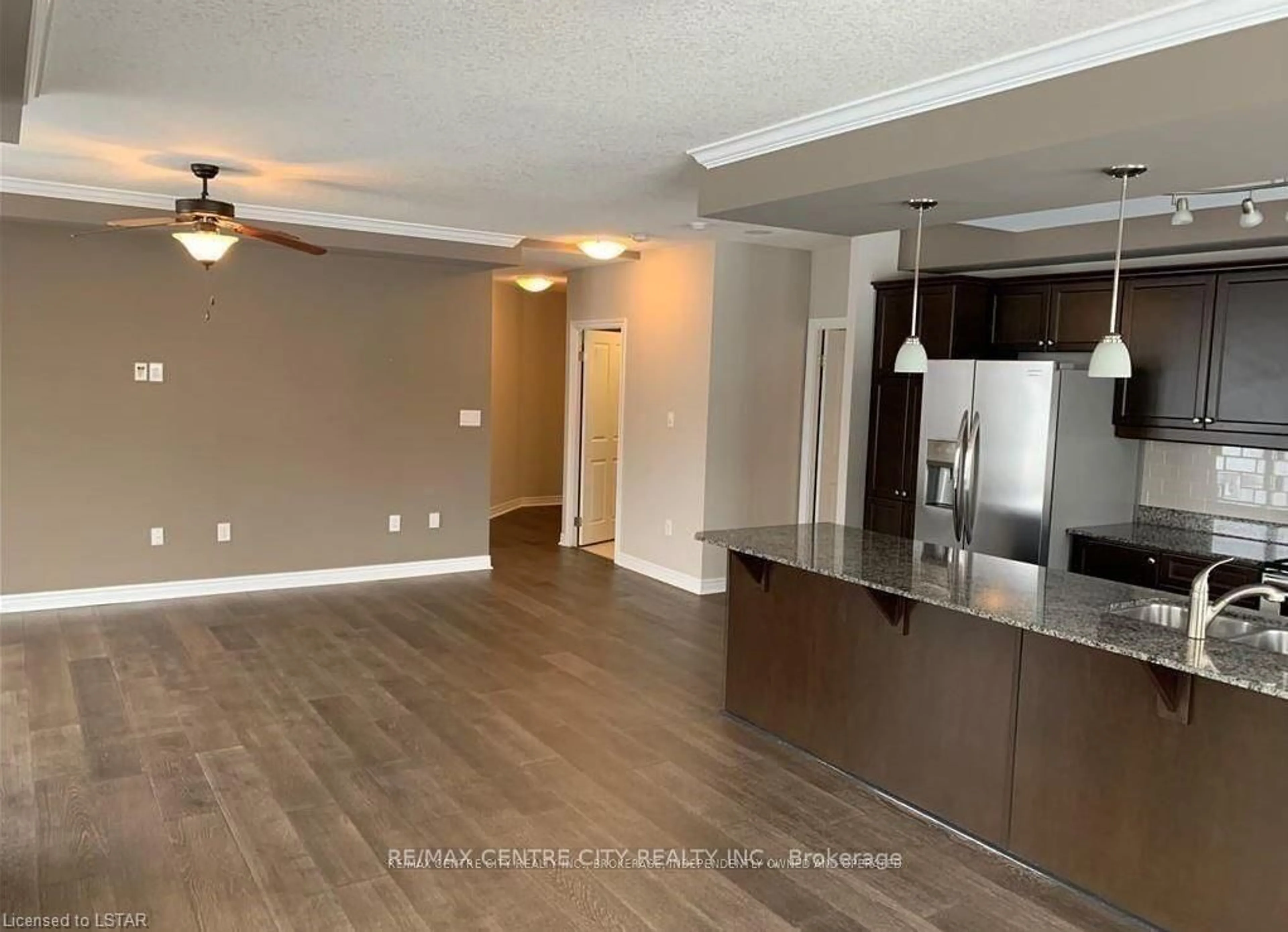 Open concept kitchen, wood/laminate floor for 1030 Coronation Dr #103, London North Ontario N6G 0G5