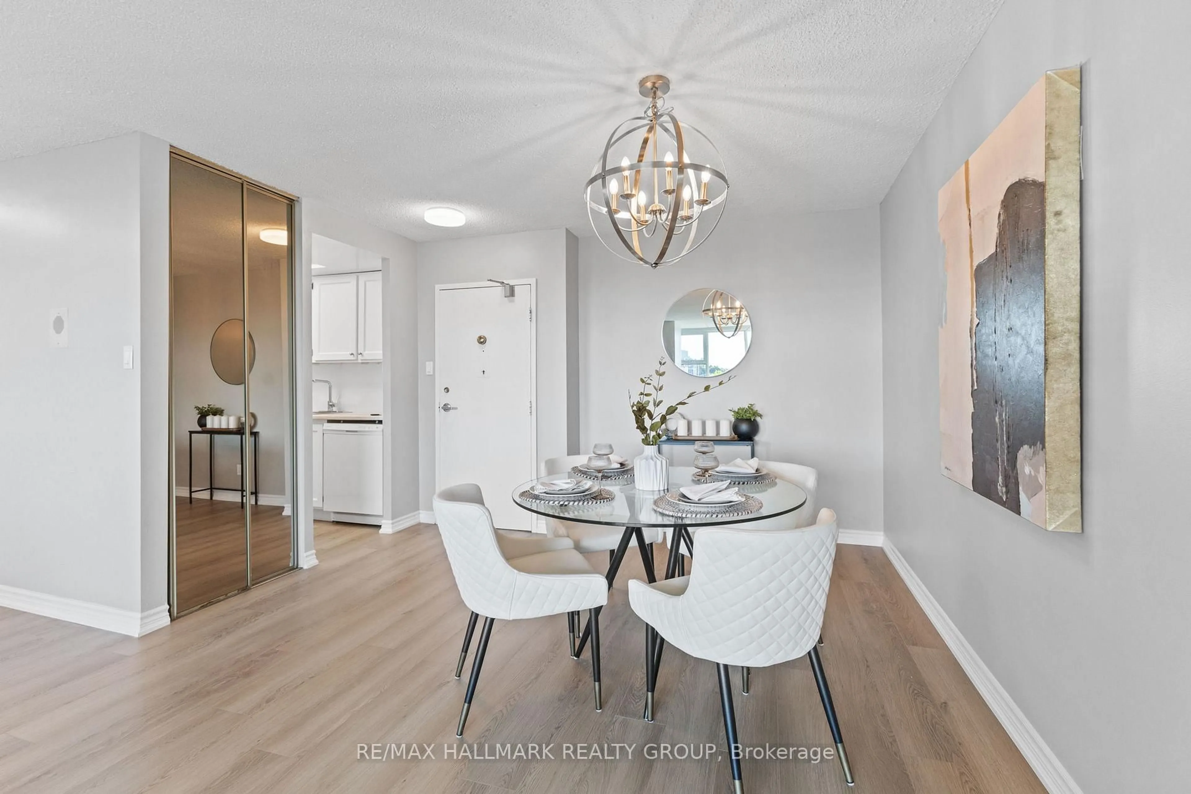 Dining room, wood/laminate floor for 555 Brittany Dr #1009, Ottawa Ontario K1K 4C5