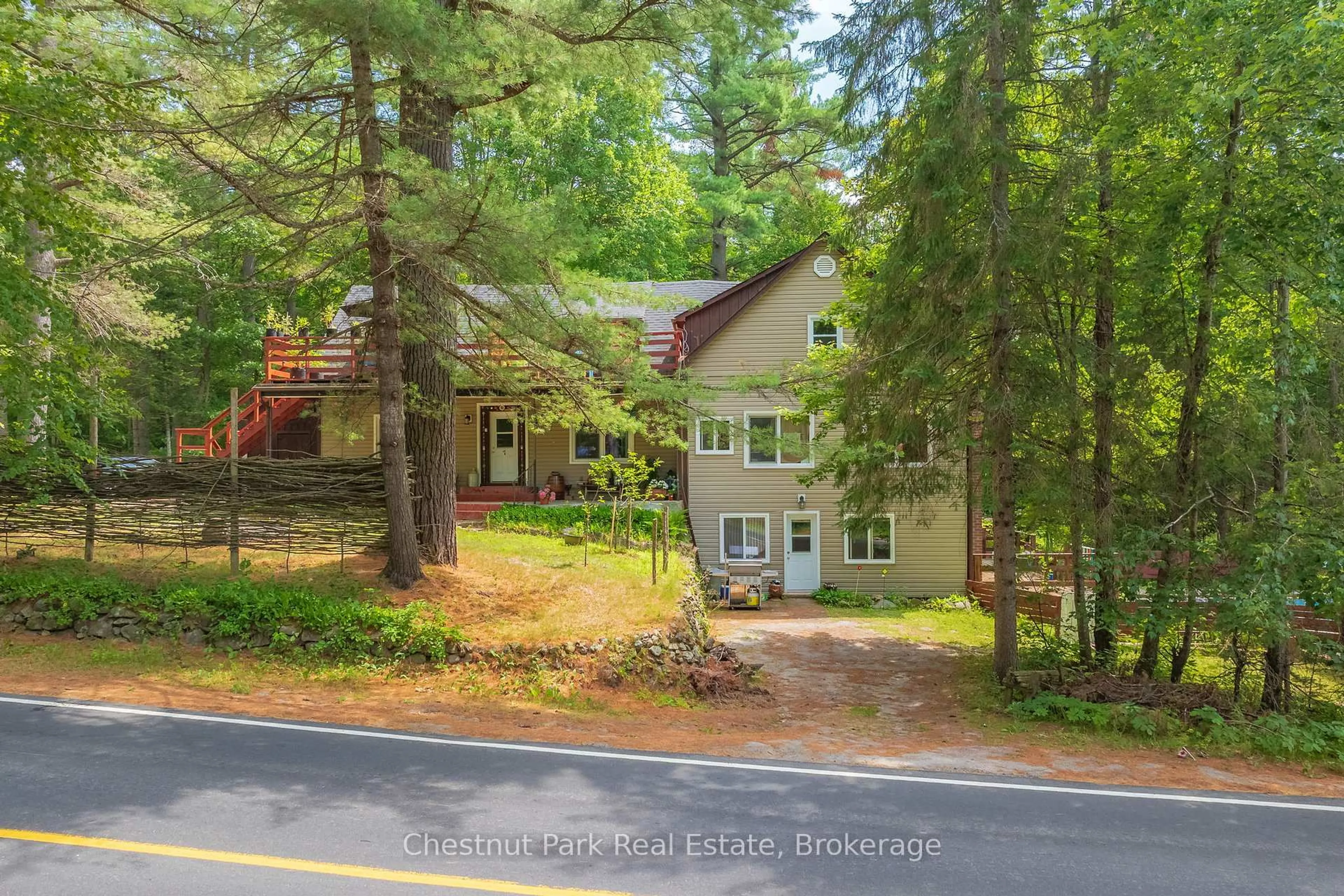 A pic from outside/outdoor area/front of a property/back of a property/a pic from drone, forest/trees view for 869 Muskoka Road 10, Huntsville Ontario P0B 1L0