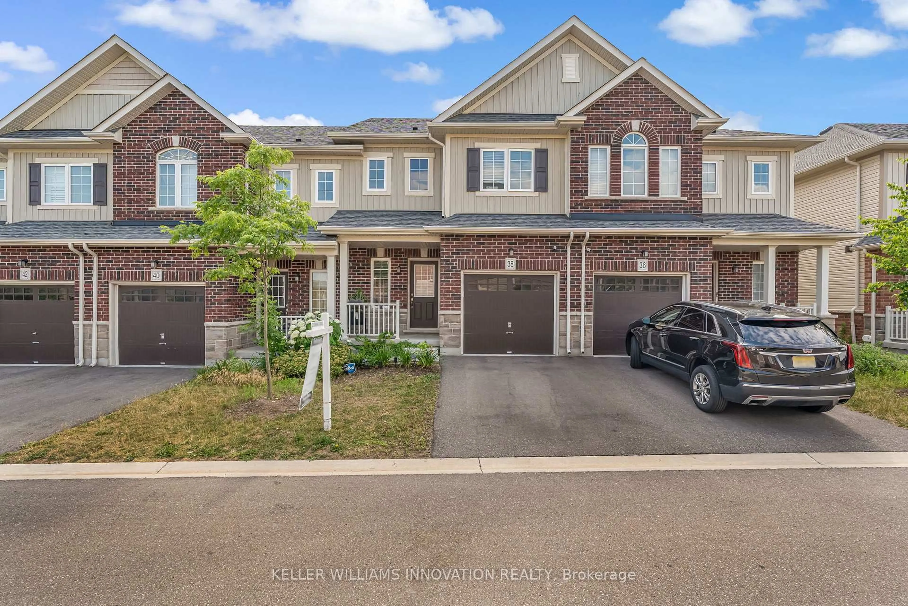 Home with brick exterior material, street for 38 Dewberry Dr, Kitchener Ontario N2B 0A9