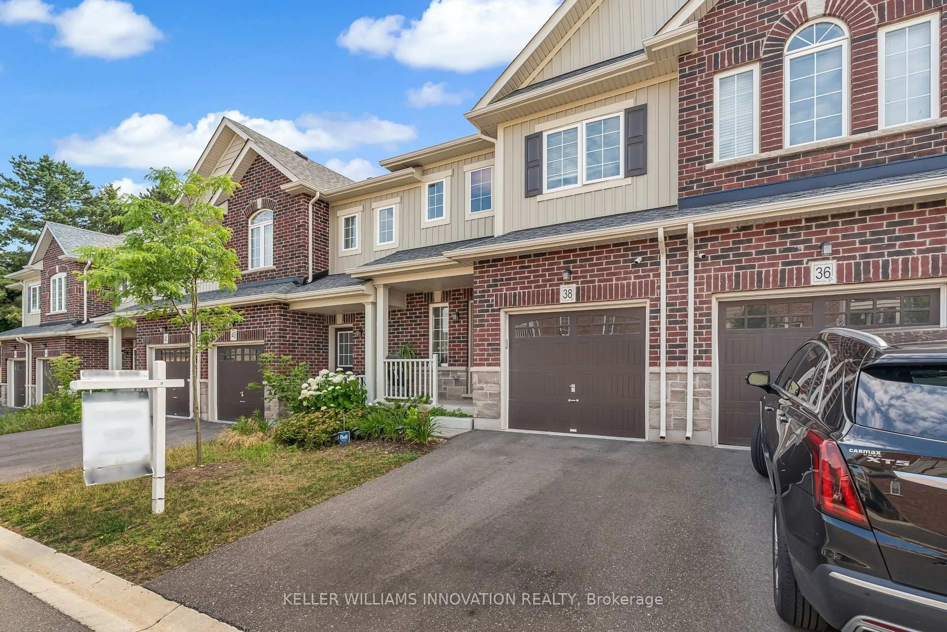 Home with brick exterior material, street for 38 Dewberry Dr, Kitchener Ontario N2B 0A9
