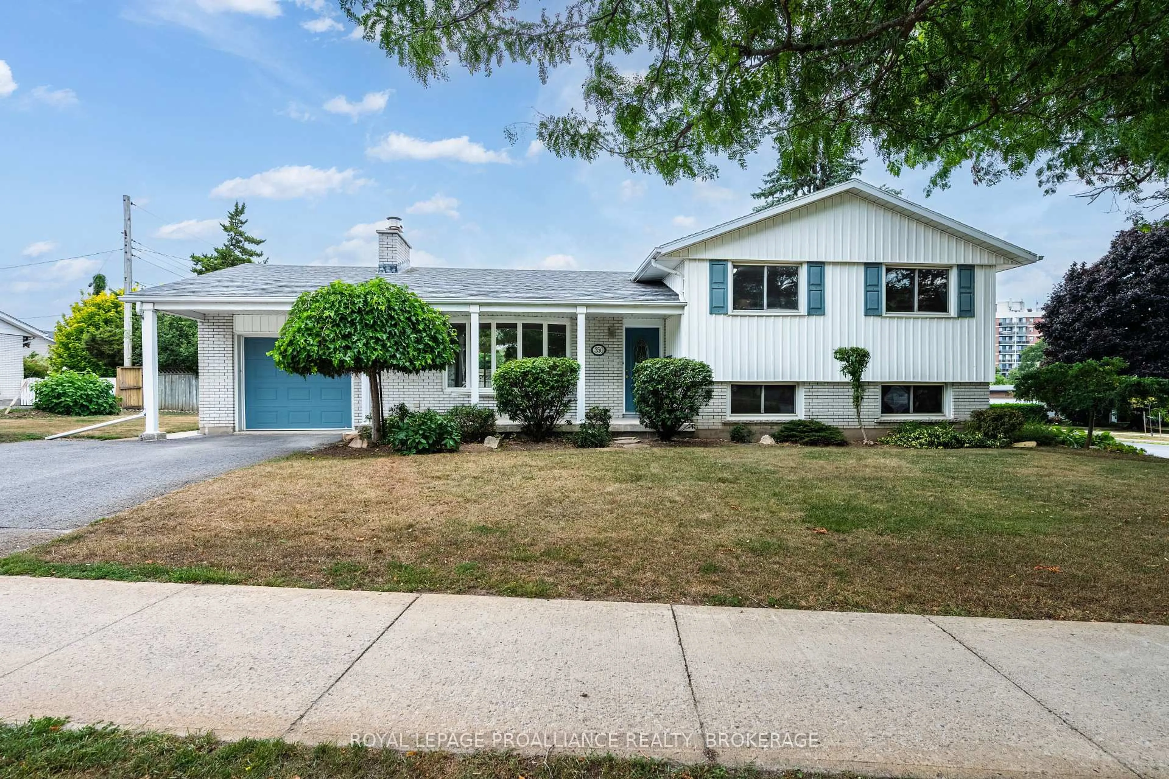 Home with vinyl exterior material, street for 350 Norman Rogers Dr, Kingston Ontario K7M 2R8