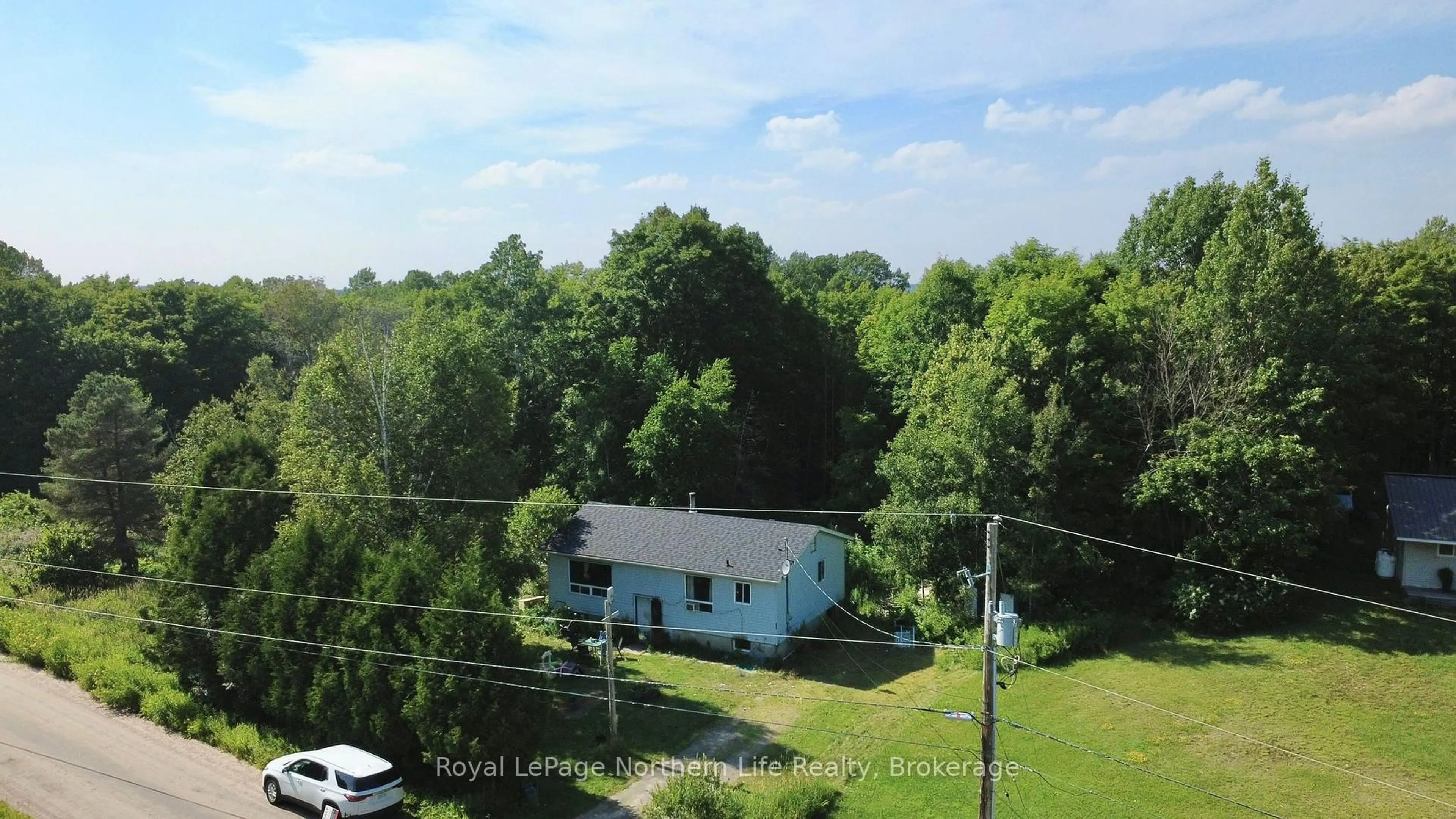 A pic from outside/outdoor area/front of a property/back of a property/a pic from drone, unknown for 494 Main St, Powassan Ontario P0H 2L0