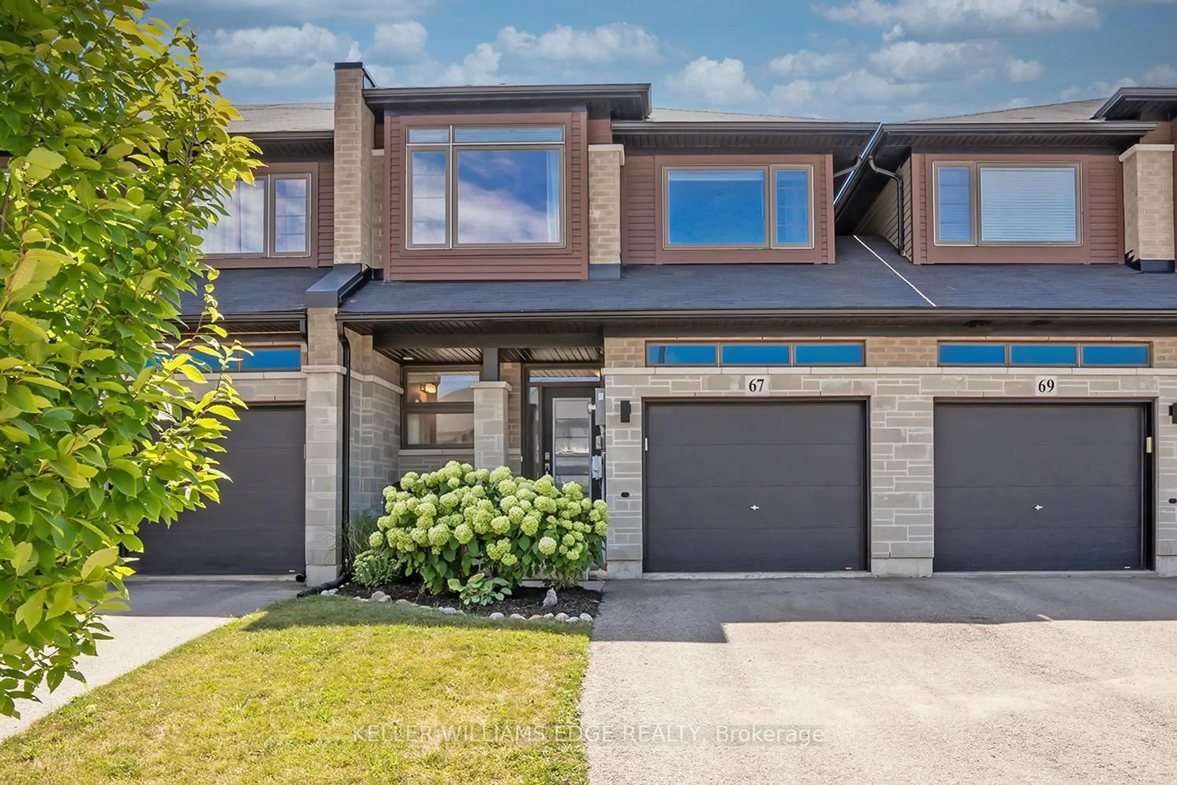 Home with brick exterior material, street for 67 Columbus Gate, Hamilton Ontario L8J 0L3