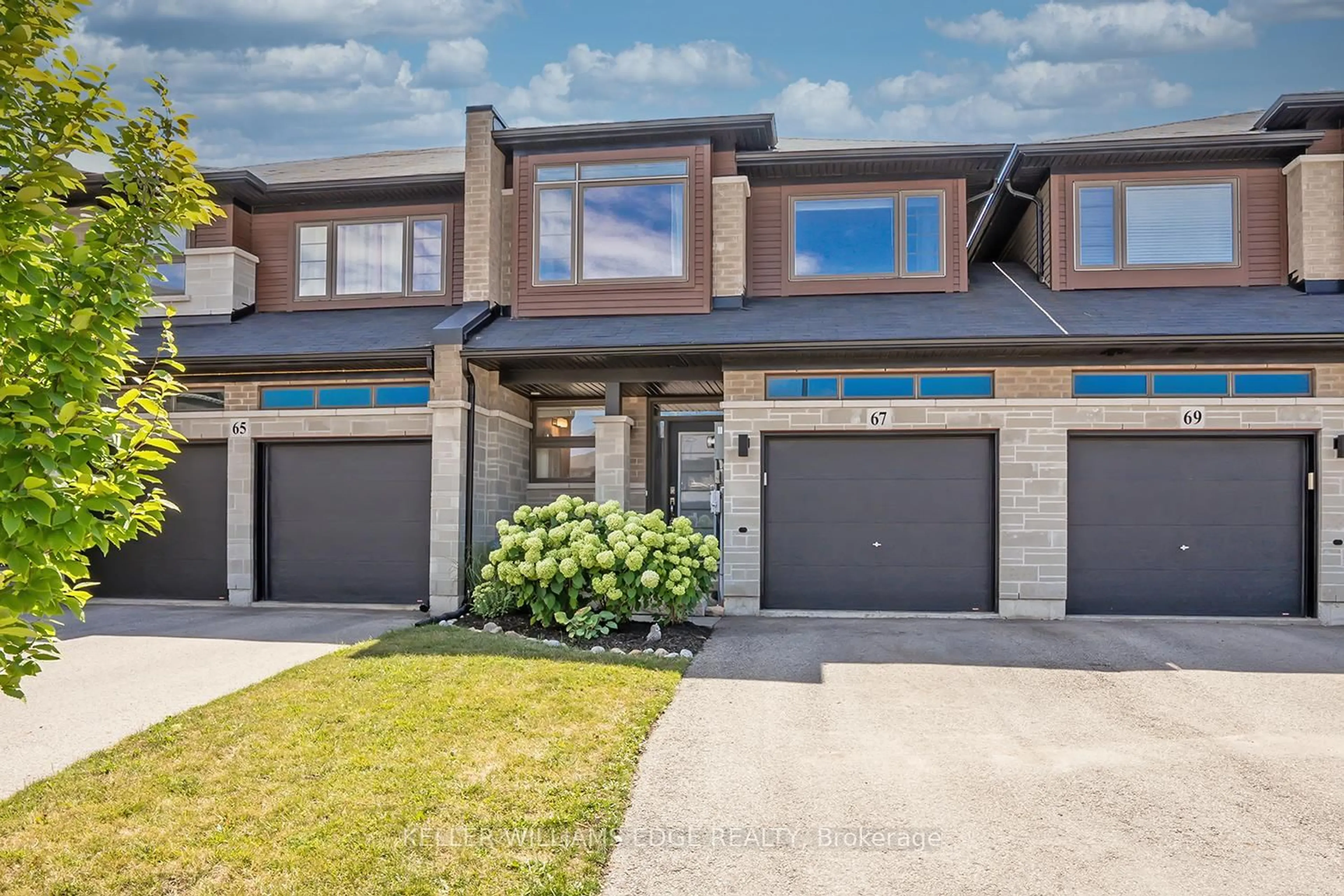 Home with brick exterior material, street for 67 Columbus Gate, Hamilton Ontario L8J 0L3