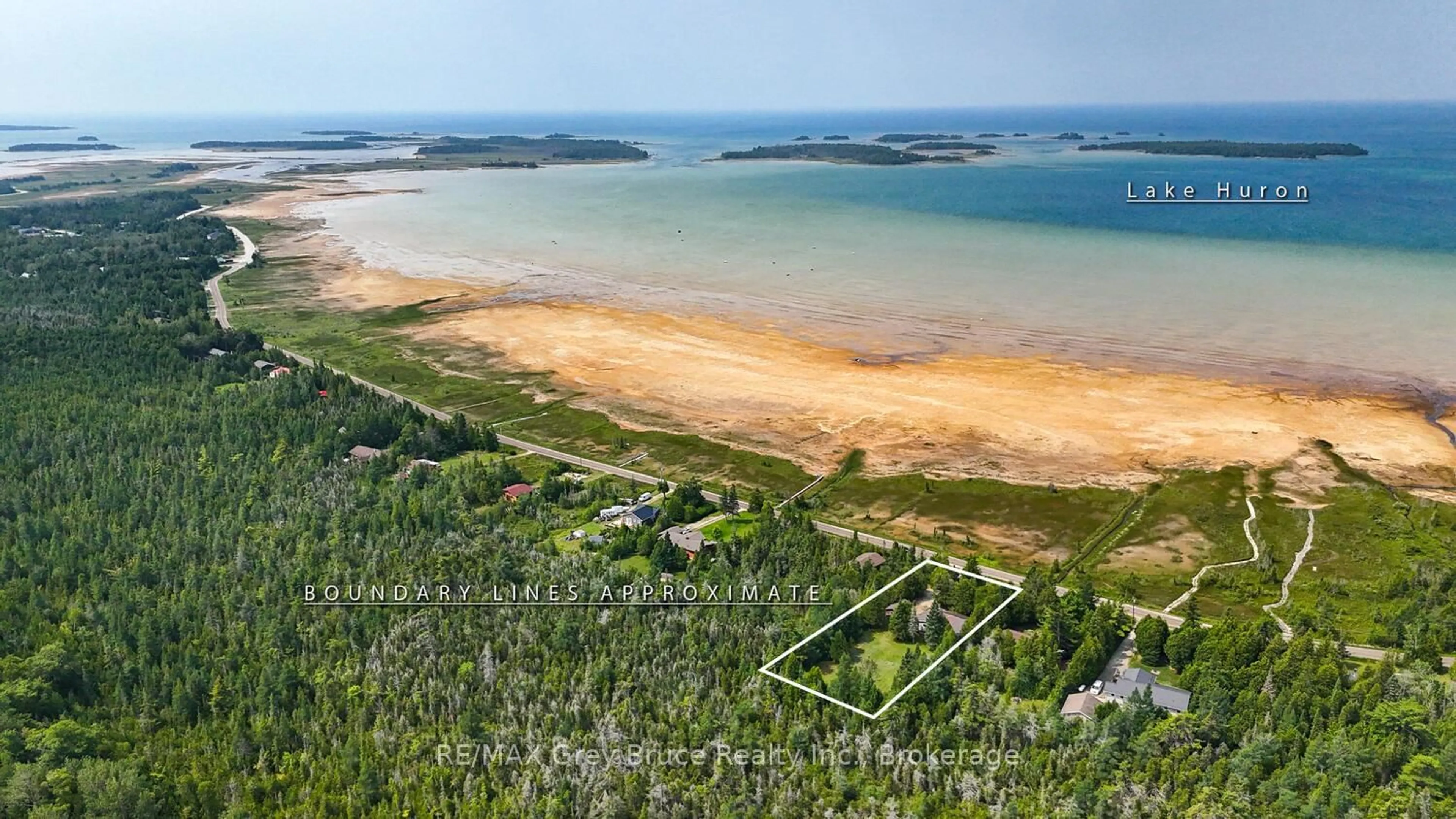 A pic from outside/outdoor area/front of a property/back of a property/a pic from drone, water/lake/river/ocean view for 465 Shoreline Ave, South Bruce Peninsula Ontario N0H 2T0