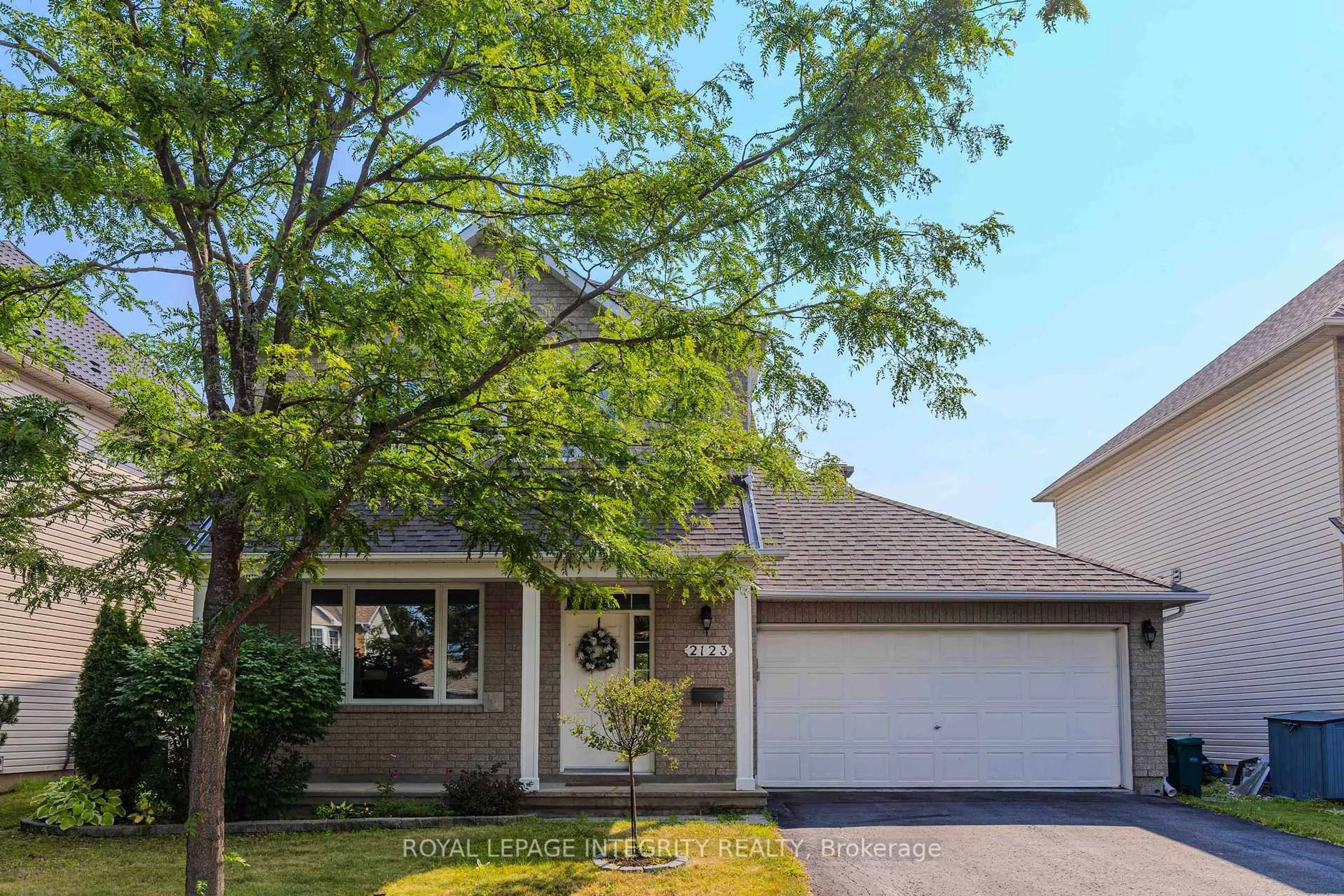 Home with vinyl exterior material, street for 2123 Esprit Dr, Orleans Ontario K4A 4K2