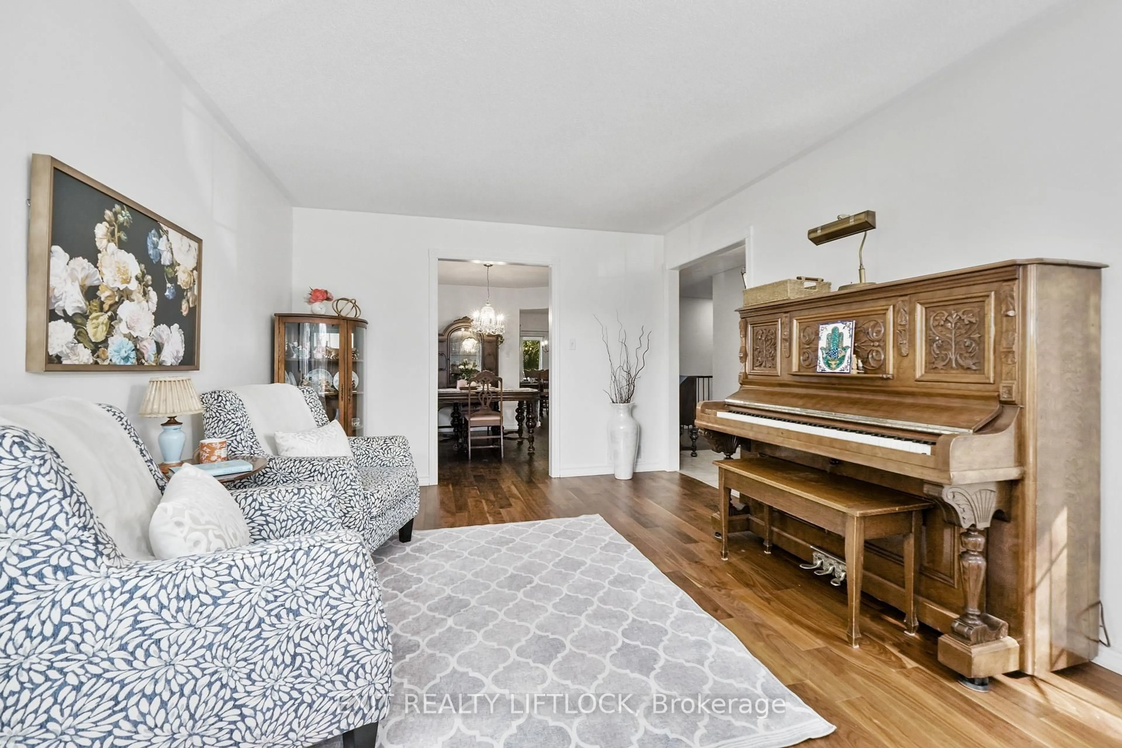 Living room with furniture, wood/laminate floor for 1373 Hetherington Dr, Peterborough North Ontario K9L 1Z5