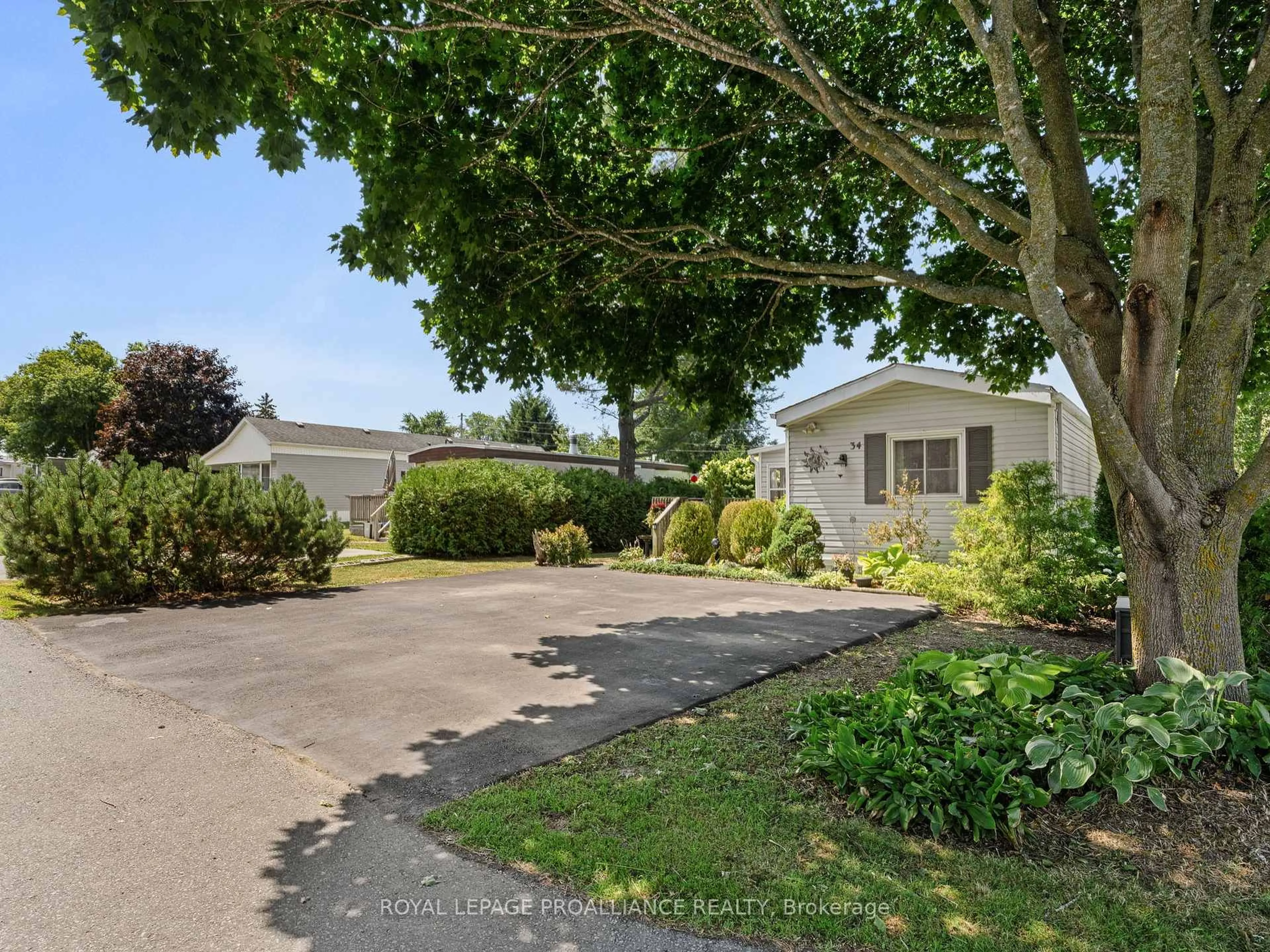 A pic from outside/outdoor area/front of a property/back of a property/a pic from drone, street for 34 Basher Dr, Hamilton Township Ontario K9A 4J7