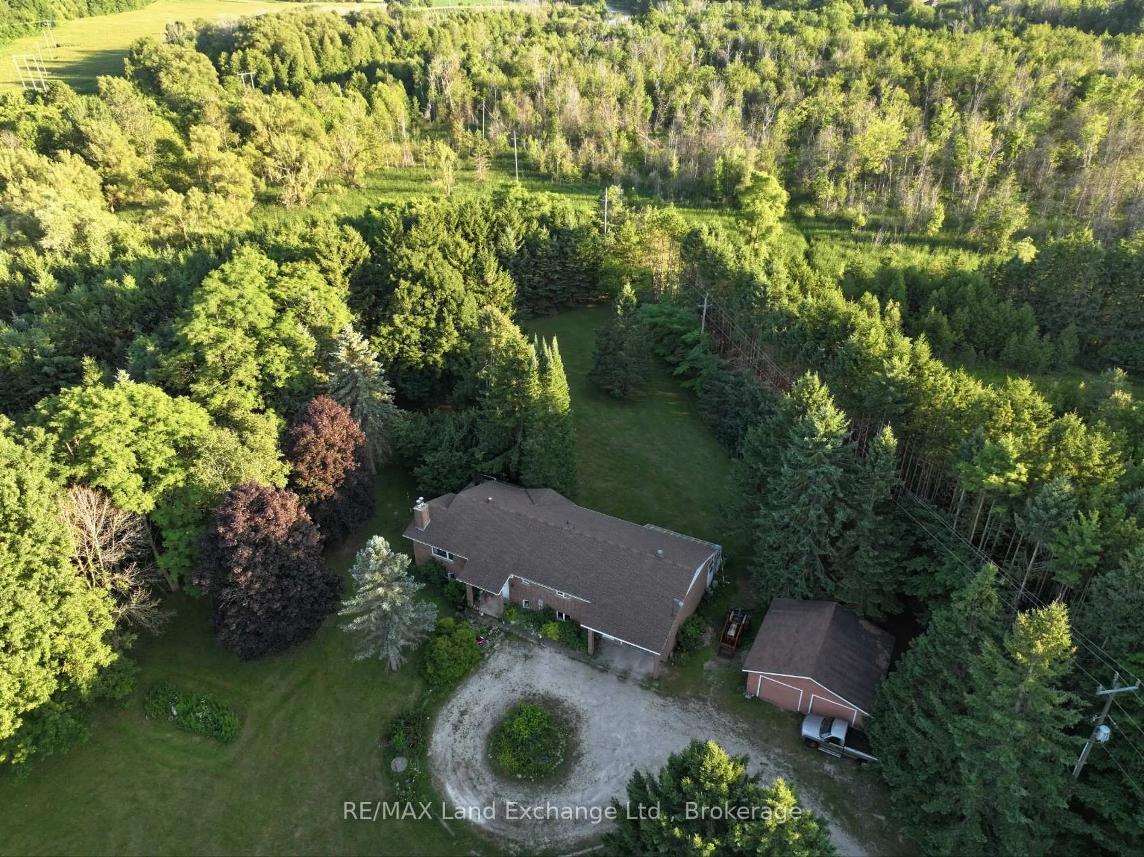 A pic from outside/outdoor area/front of a property/back of a property/a pic from drone, forest/trees view for 340 South St, Brockton Ontario N0G 2V0