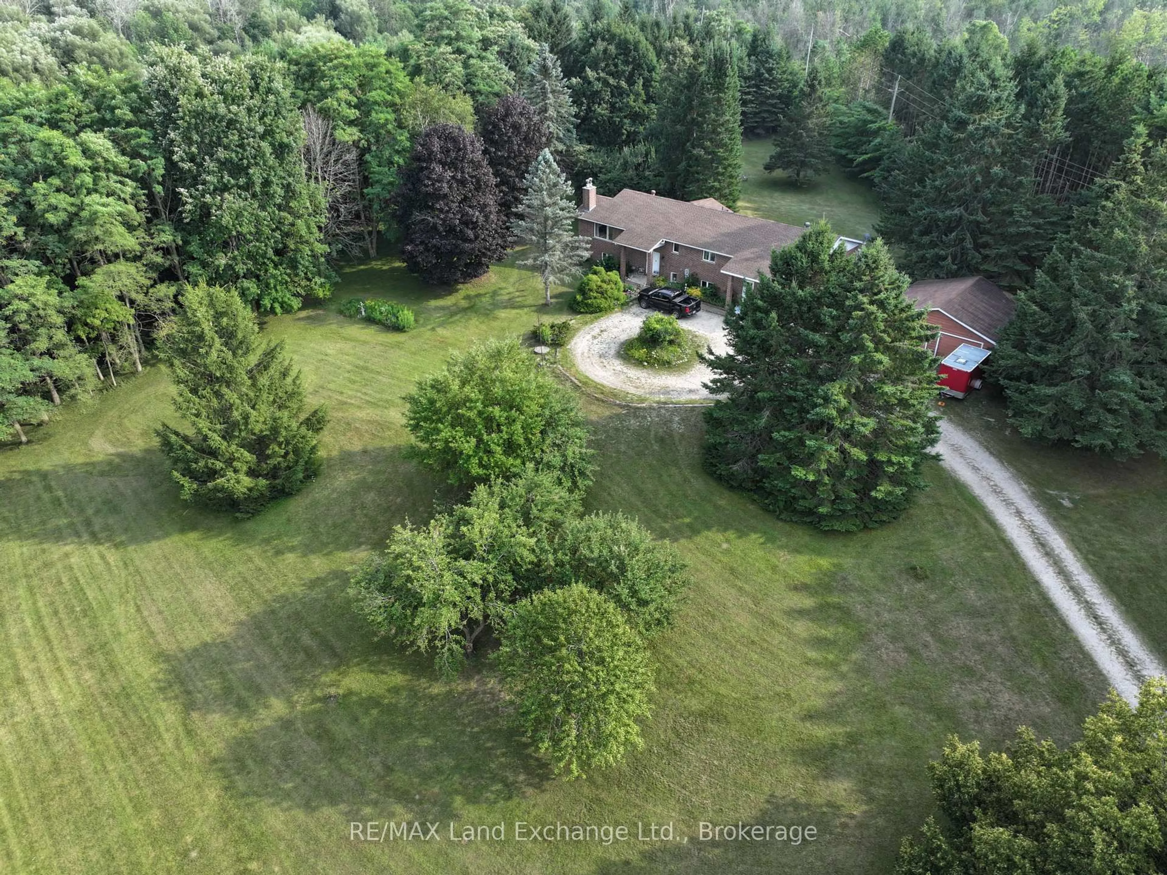 A pic from outside/outdoor area/front of a property/back of a property/a pic from drone, forest/trees view for 340 South St, Brockton Ontario N0G 2V0