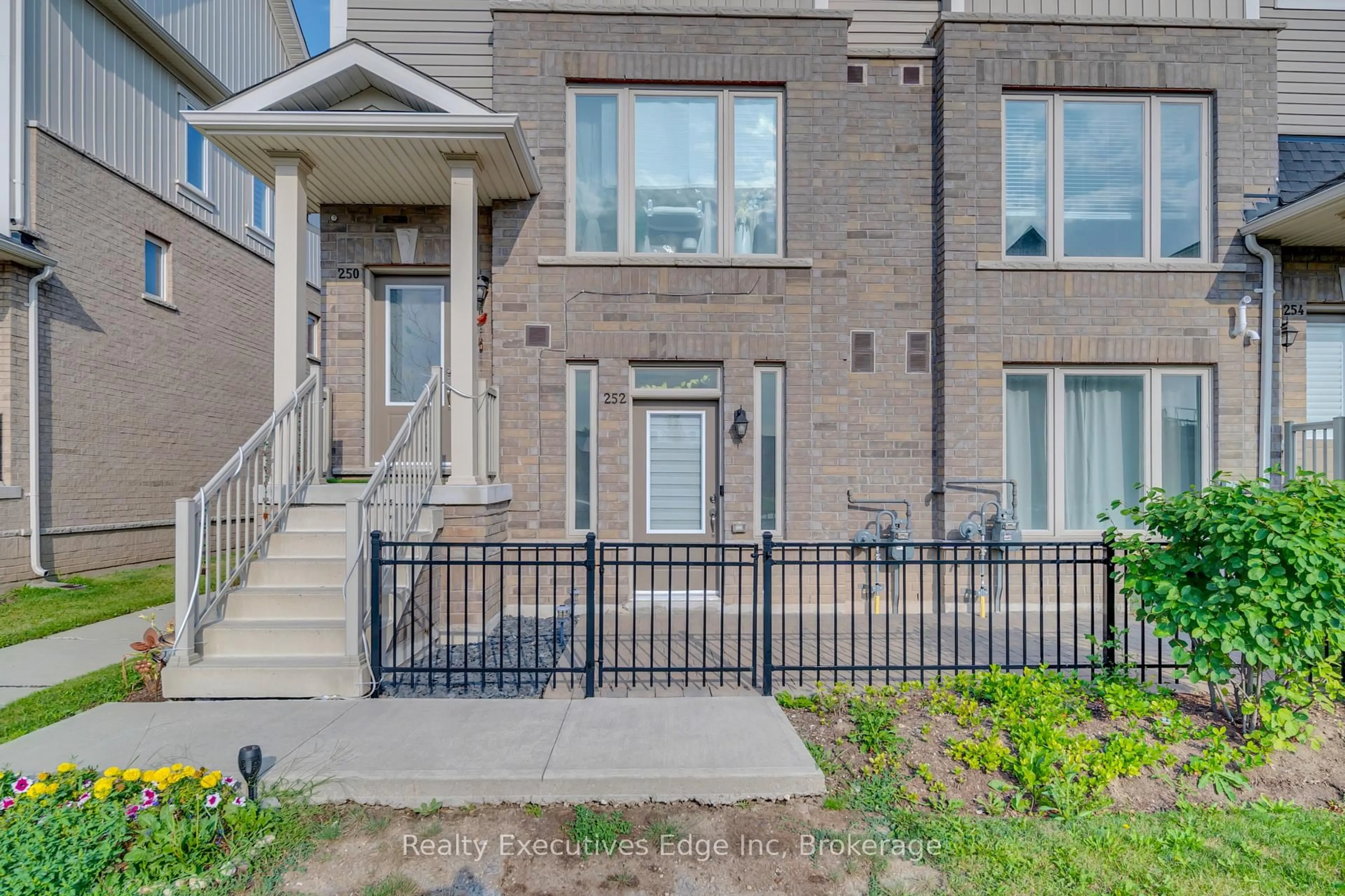 Home with brick exterior material, street for 252 Law Dr #65, Guelph Ontario N1E 0P6