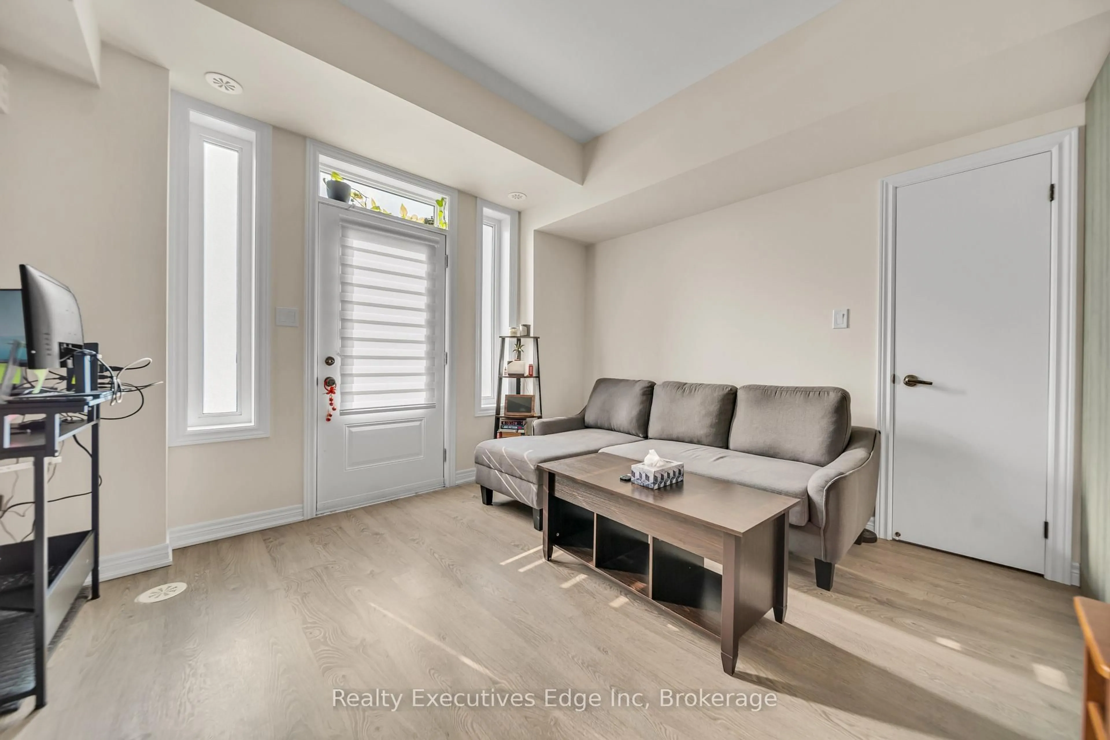 Living room with furniture, unknown for 252 Law Dr #65, Guelph Ontario N1E 0P6