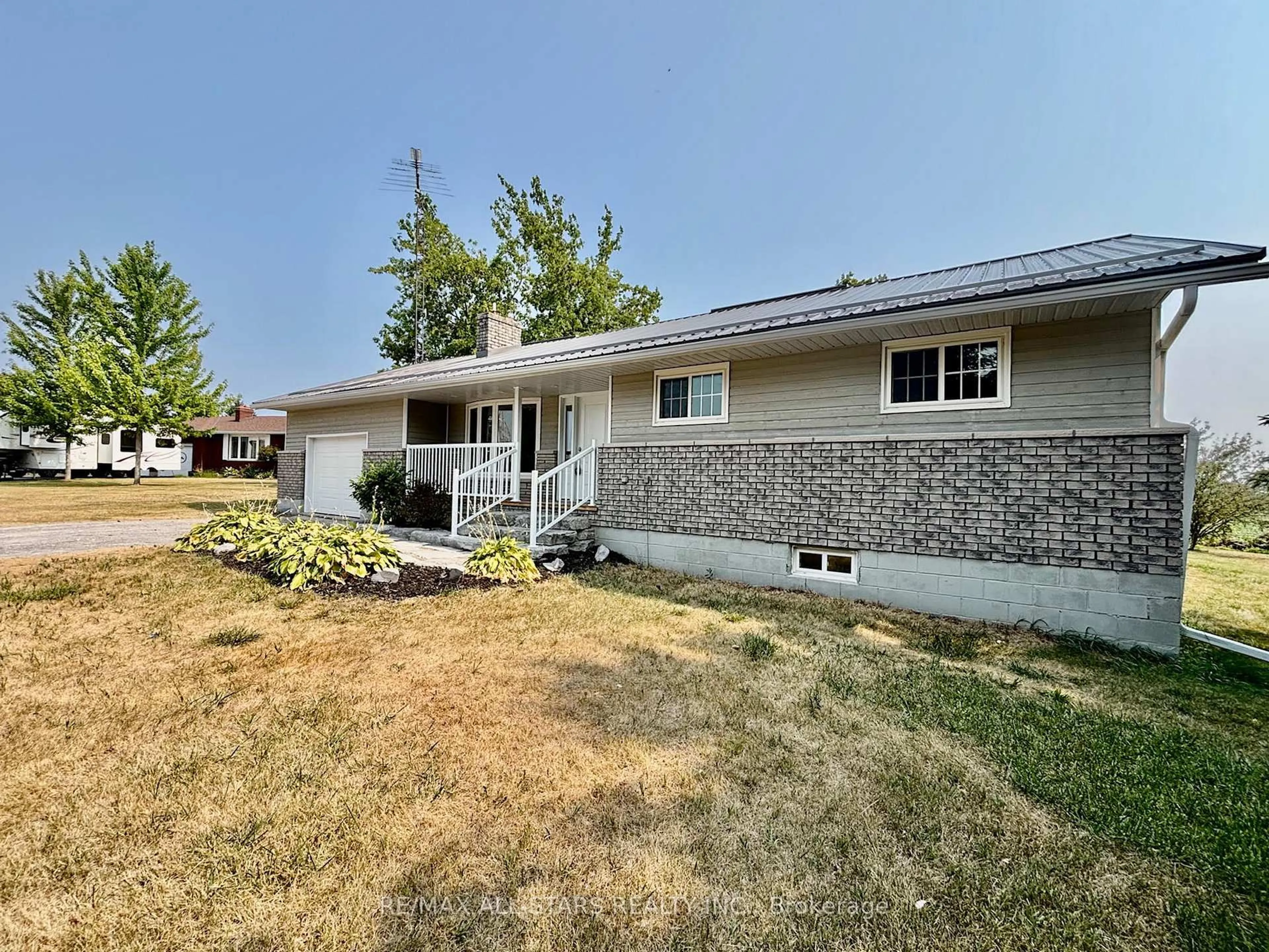 Home with vinyl exterior material, street for 23 Bruce St, Kawartha Lakes Ontario K0M 2M0