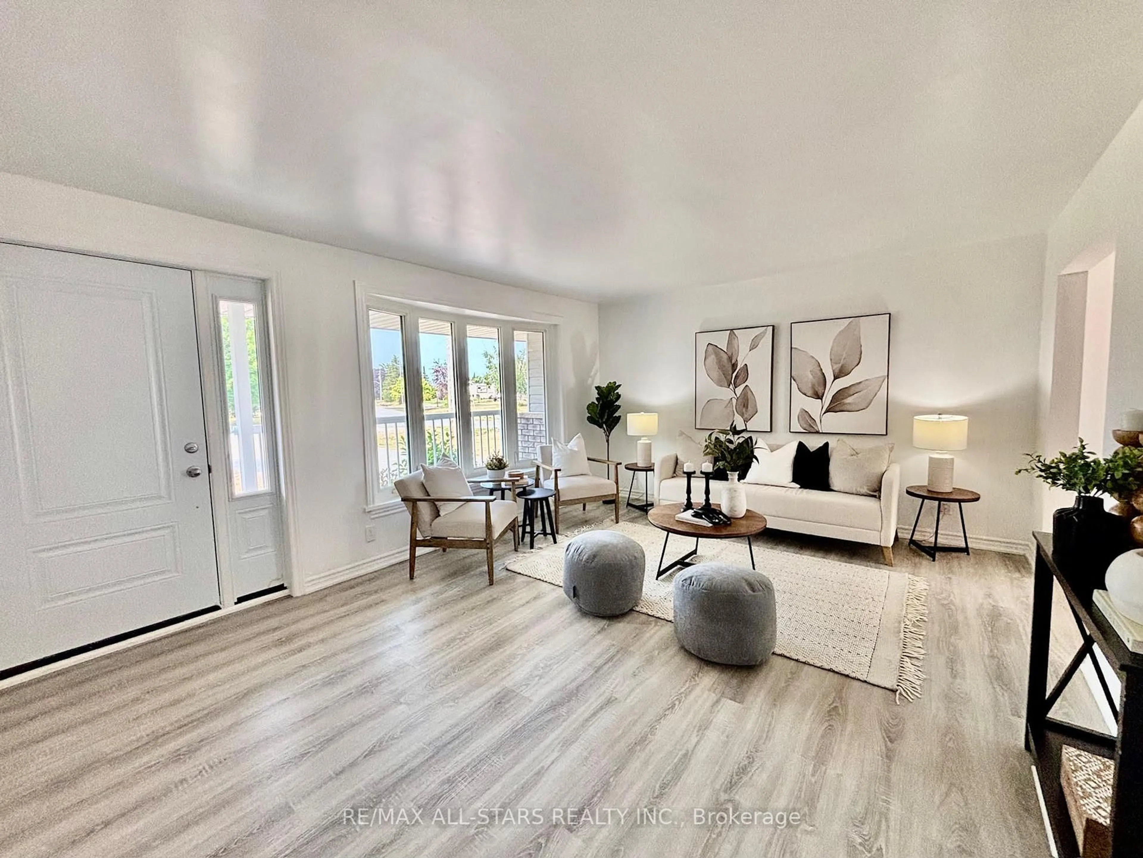 Living room with furniture, wood/laminate floor for 23 Bruce St, Kawartha Lakes Ontario K0M 2M0