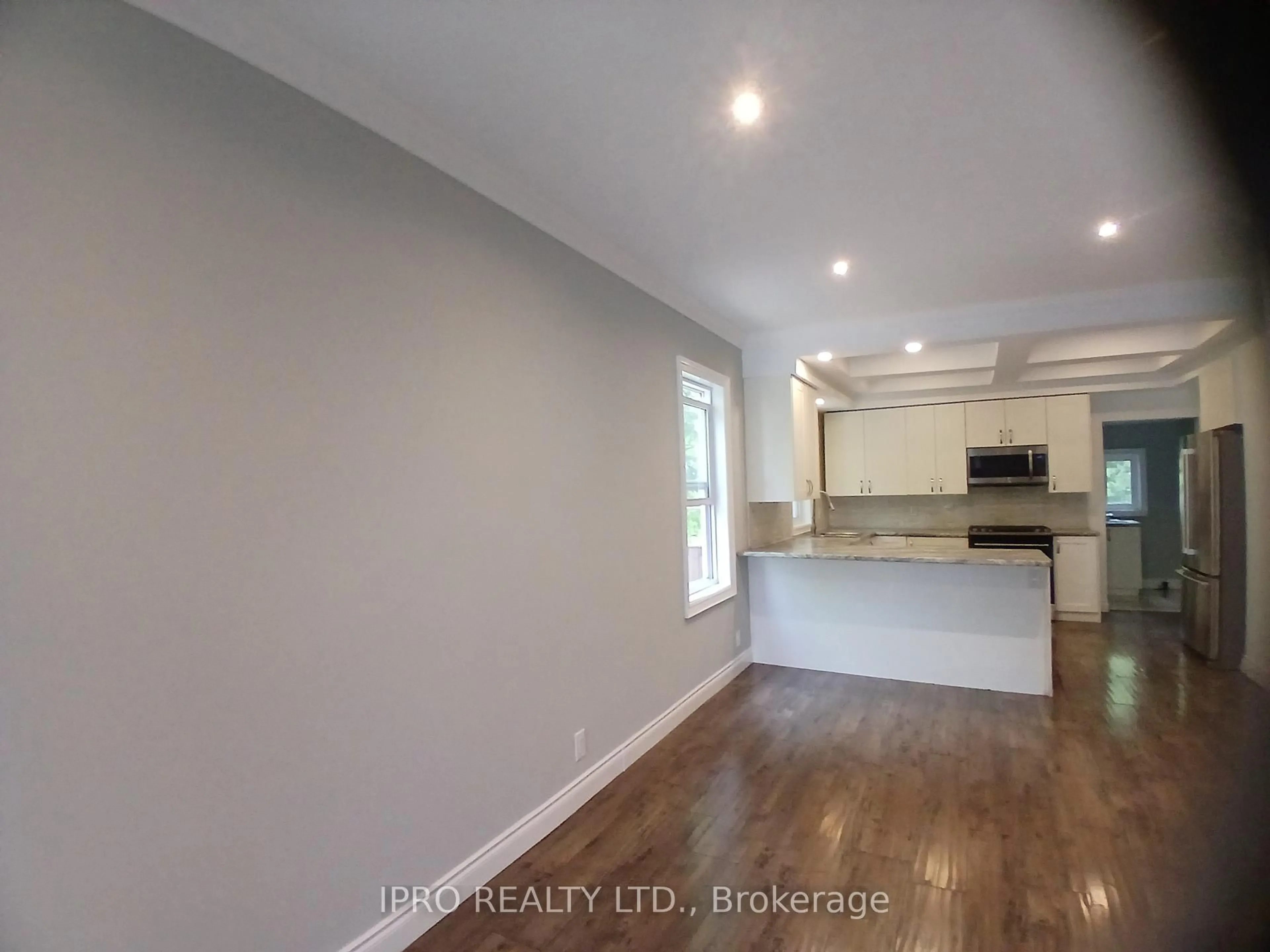 Open concept kitchen, wood/laminate floor for 49 East 9th St, Hamilton Ontario L9A 3M6