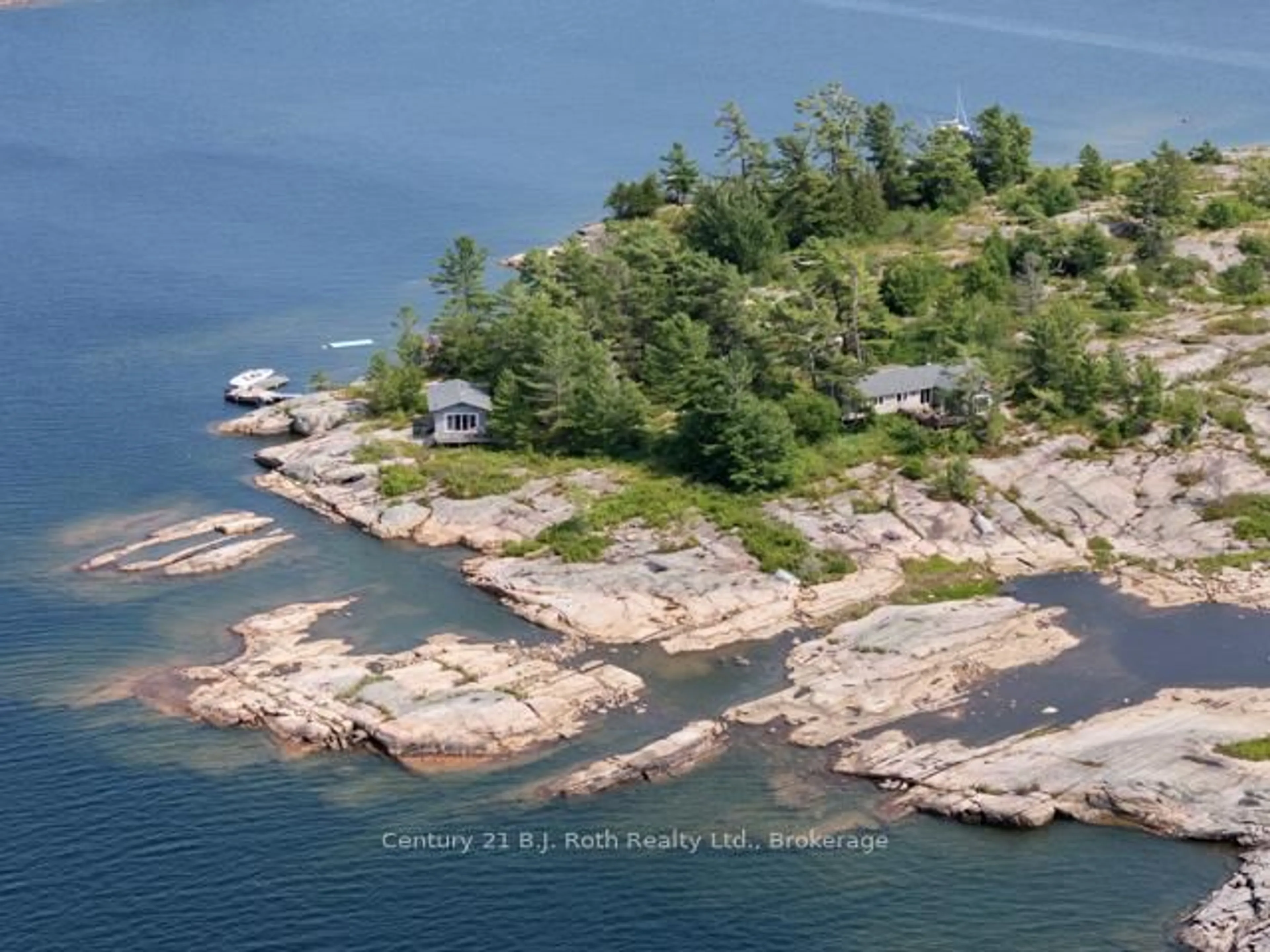 A pic from outside/outdoor area/front of a property/back of a property/a pic from drone, water/lake/river/ocean view for 1 252c Island, Carling Ontario P0G 1G0