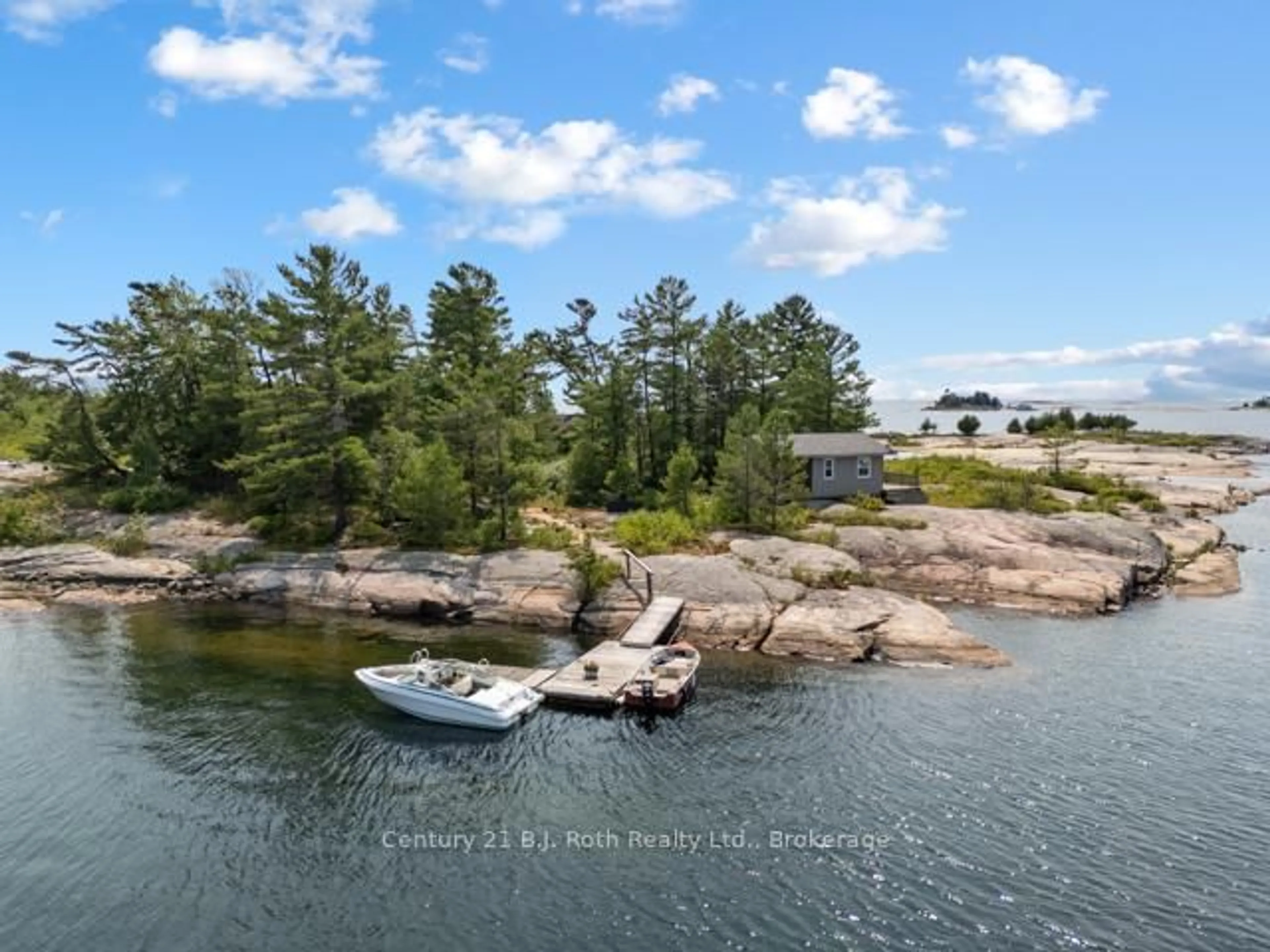 A pic from outside/outdoor area/front of a property/back of a property/a pic from drone, water/lake/river/ocean view for 1 252c Island, Carling Ontario P0G 1G0
