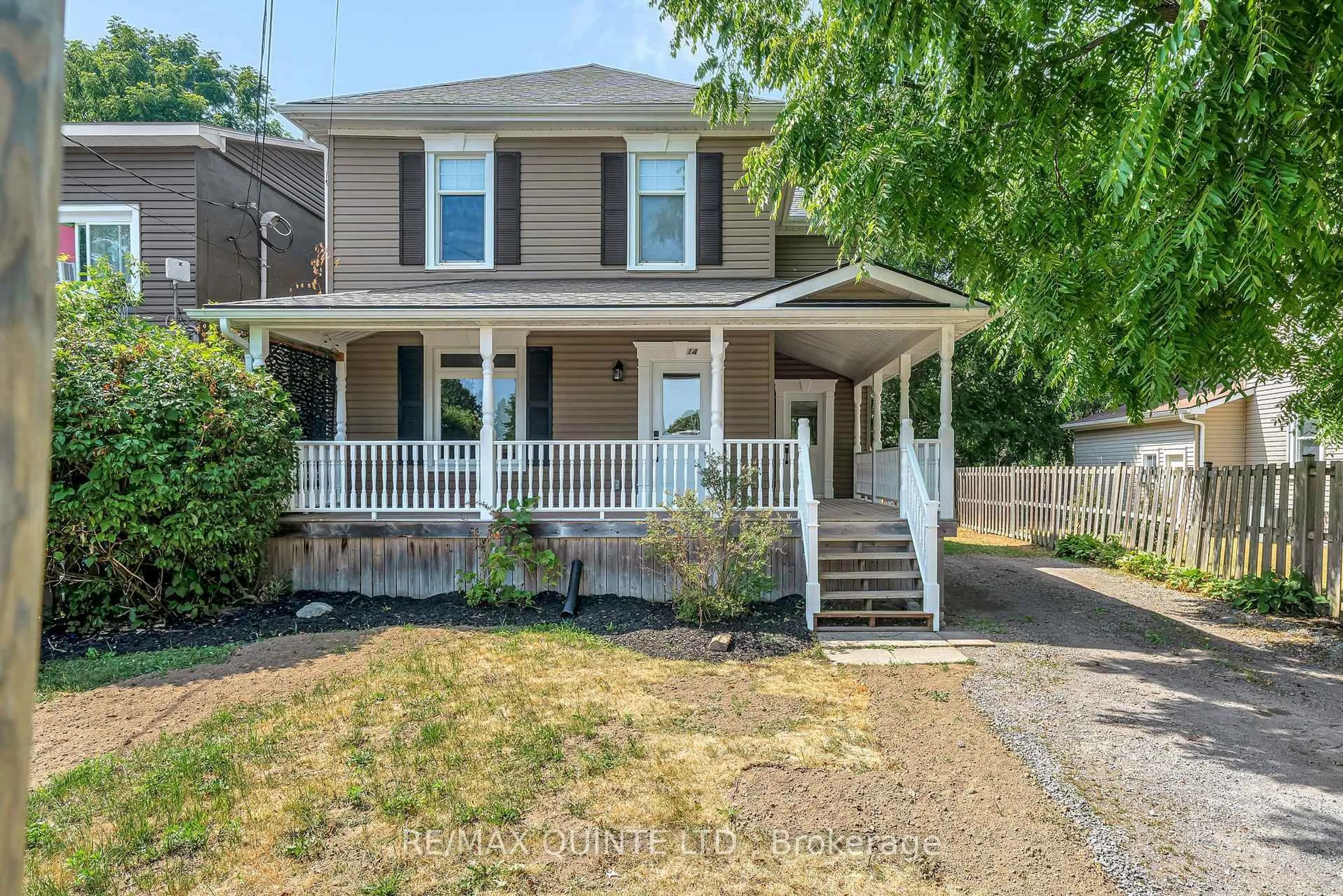 Home with vinyl exterior material, street for 14 Elm St, Prince Edward County Ontario K0K 2T0