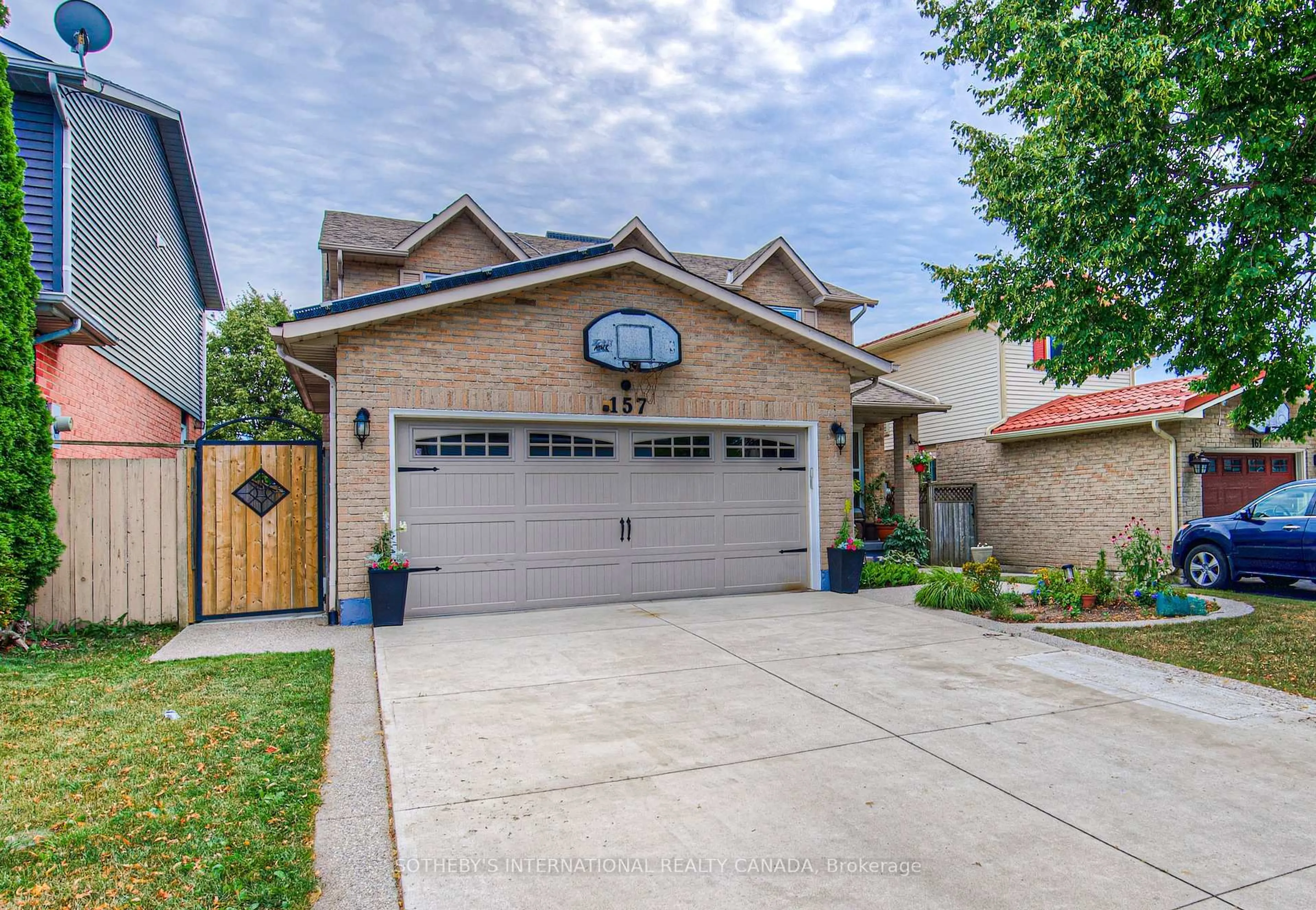 Home with brick exterior material, street for 157 Twin Cres, Hamilton Ontario L8W 3A7