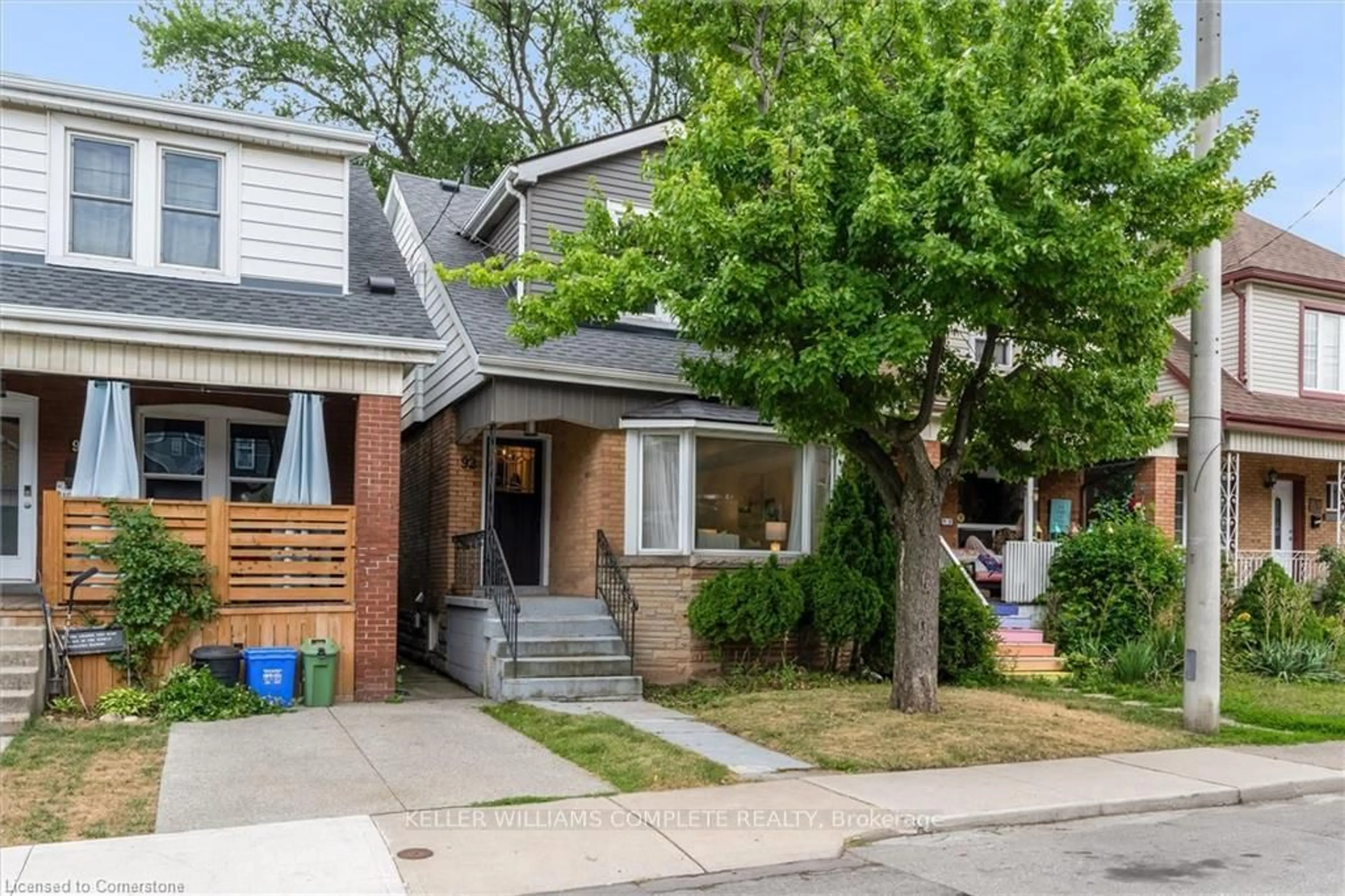 Home with brick exterior material, street for 92 Kensington Ave, Hamilton Ontario L8L 7N2