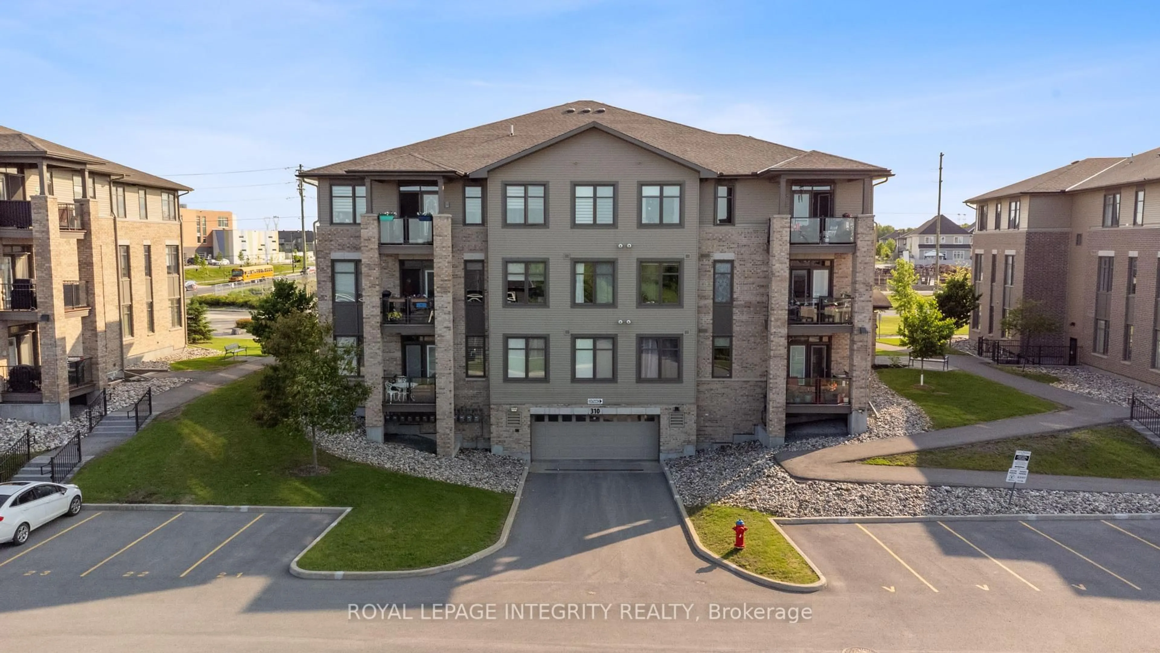 A pic from outside/outdoor area/front of a property/back of a property/a pic from drone, building for 310 Jatoba Private #104, Ottawa Ontario K2V 0E7